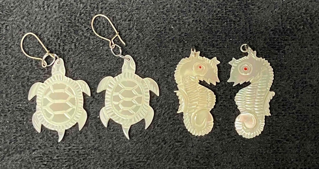 Vintage Mother Of Pearl Hand Carved Turtle & Seahorse Earrings: This lot contains a Vintage Mother Of Pearl Hand Carved Turtle & Seahorse Earrings. The earrings fit in a small 3 3/4" x 2 1/4" plastic bag. Total weight is approx 0.2oz. Overall the Mother of pearl