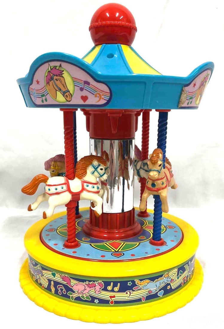 Vintage Redbox 1991 Musical Carousel: This lot contains a Vintage Redbox 1991 Musical Carousel. It is approx 7 3/4" x 7 3/4" x 10 1/2" and it weighs about 1.7lbs. Overall the vintage toy is in good used condition with some light wear cons