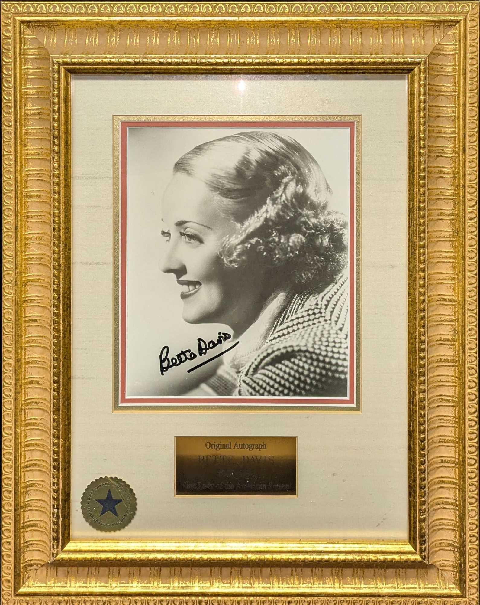 Framed Bette Davis Autographed Photo With COA R77: Framed Bette Davis Autographed Photo With COA R77. The framed photo is approx 15 1/4" x 1 1/4" x 19" and it weighs 3.70lbs. Comes with a COA from Walt Disney World. The Walt Disney World s