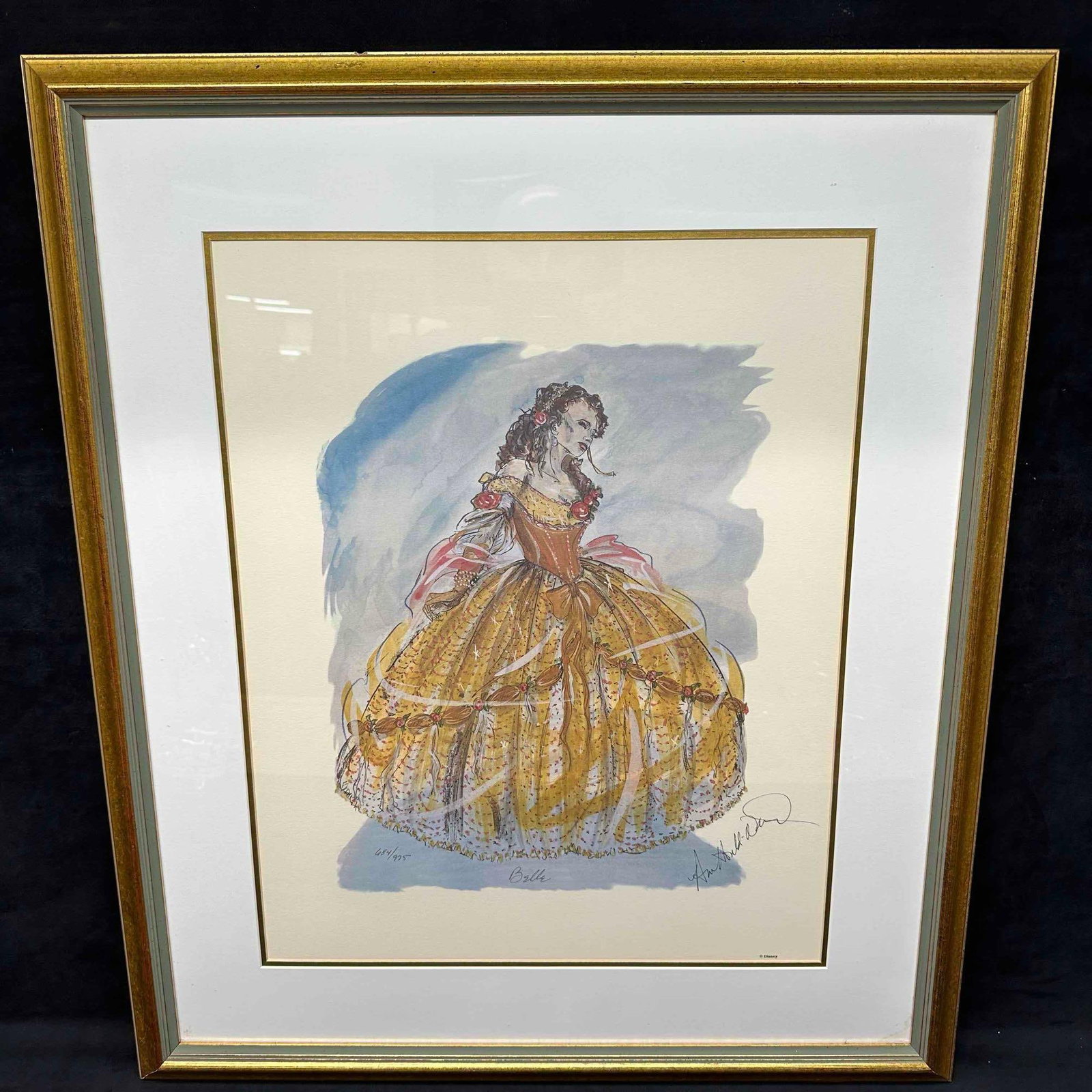 Ann Hould-Ward Beauty and the Beast Belle Limited Edition Framed Lithograph Disney Art: This framed limited edition lithograph by renowned costume designer Ann Hould-Ward. the artwork features a beautifully detailed costume sketch of "Belle", likely inspired by her acclaimed work