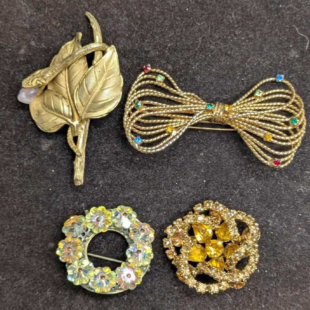 Vintage Unmarked Amber Rhinestone AB Crystals Brooch Pins Lot Of 4: Vintage Unmarked Amber Rhinestone AB Crystals Brooch Pins Lot Of 4. This lot includes: (1) Unmarked Gold Tone Leaf With Glass Bead Brooch. This is approx 3" x 1 3/4" x 1/2". (1) Unmarked