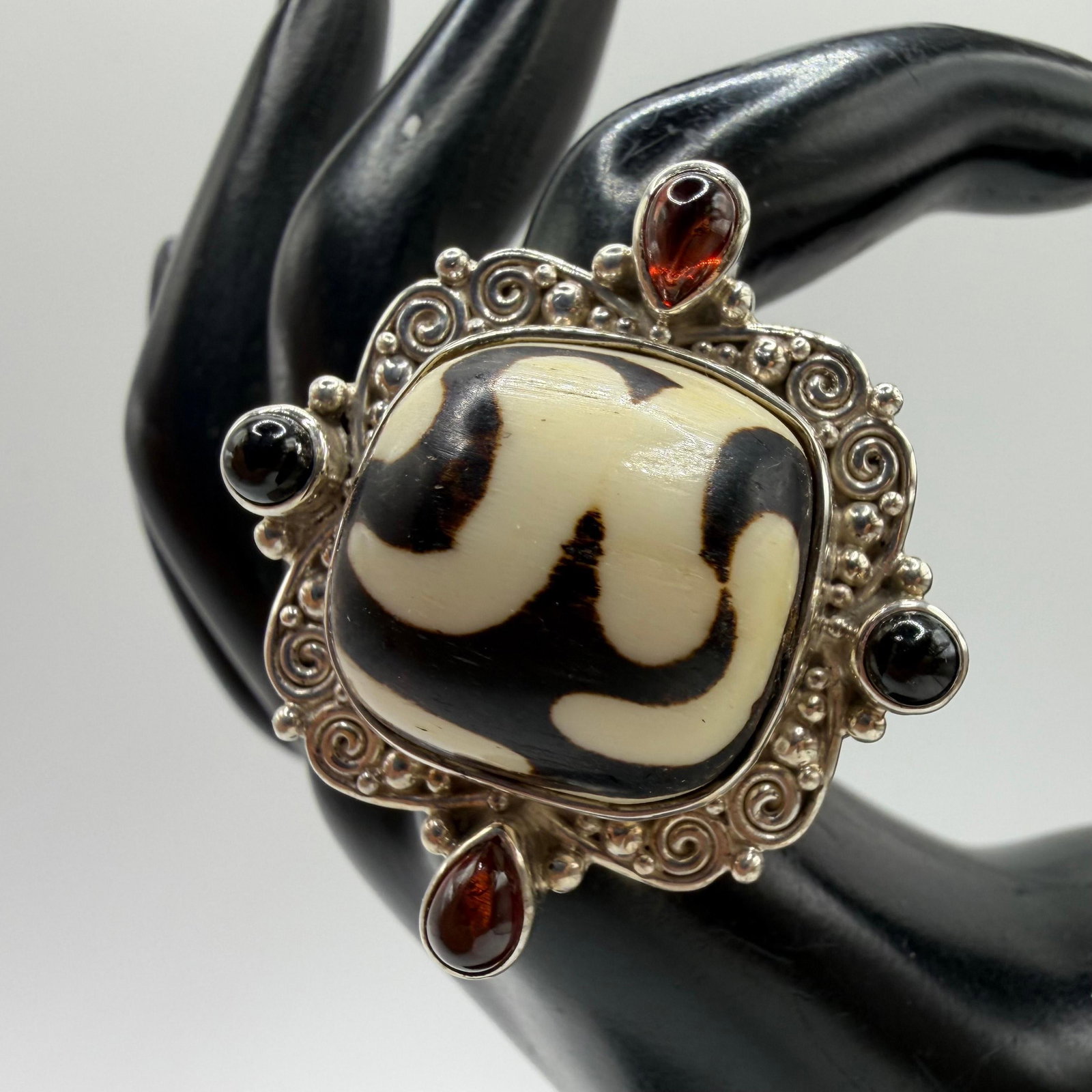 Sajen Sterling Silver Ring Dzi Bead Garnet and Black Onyx: This item is in pre-owned, previously used/displayed condition with noticeable light wear and surface scratches. Please reference all photos for full details. This piece of jewelry has been carefully 