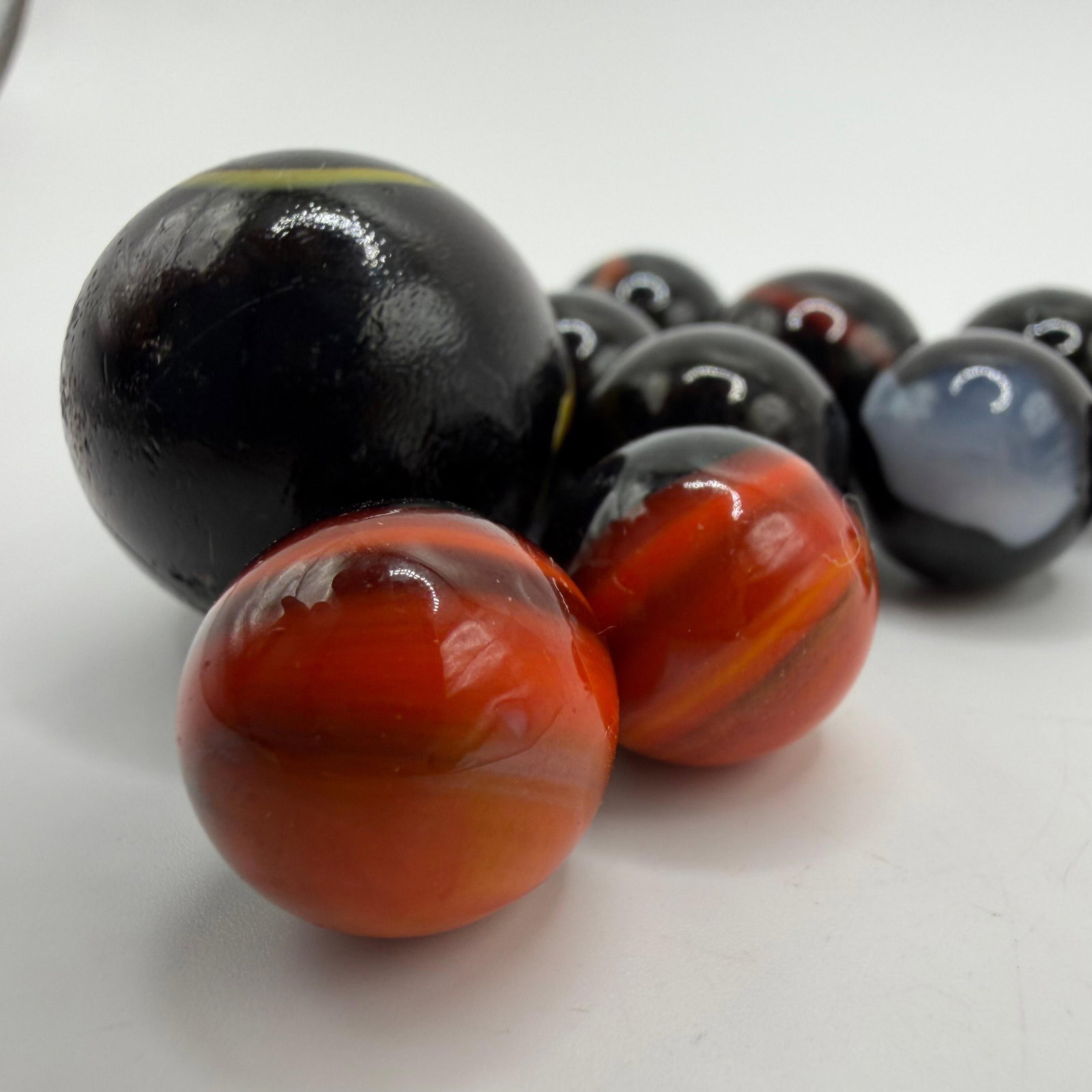 Black Base Cats Eye Glass Marble Collection with Player and Shooter Marbles (1 of 10)