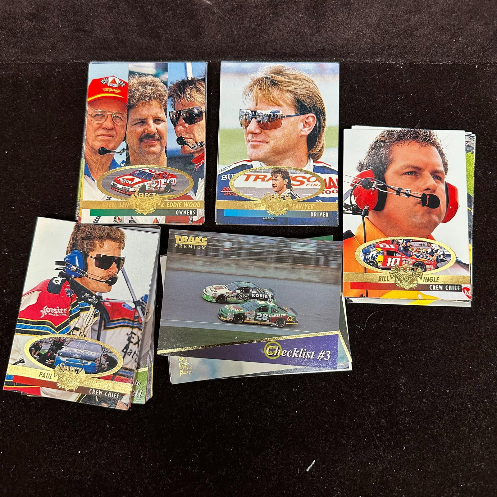 100 NASCAR Racing Trading Cards Lot Traks Select Upper Deck Era: Group of 100 NASCAR racing trading cards from the 1990s era. Includes cards from sets such as Traks, Select, and other contemporary racing card releases. Drivers and crew members represented include e