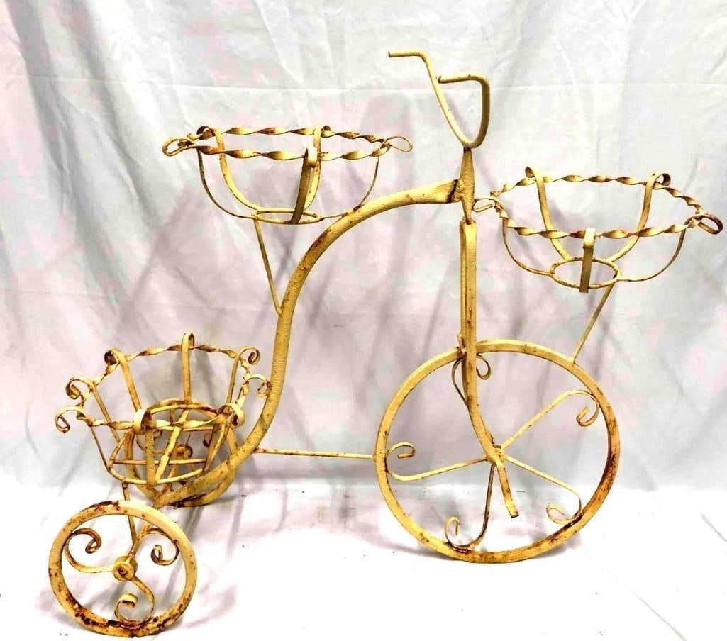 Vintage Bicycle Plant Stand Garden Sculpture: This lot contains a vintage wrought iron bicycle plant stand/garden sculpture. The plant stand/sculpture is approx 36" x 12 1/2" x 27 3/4" and weighs about 2.8lbs. It features three baskets for pots/p