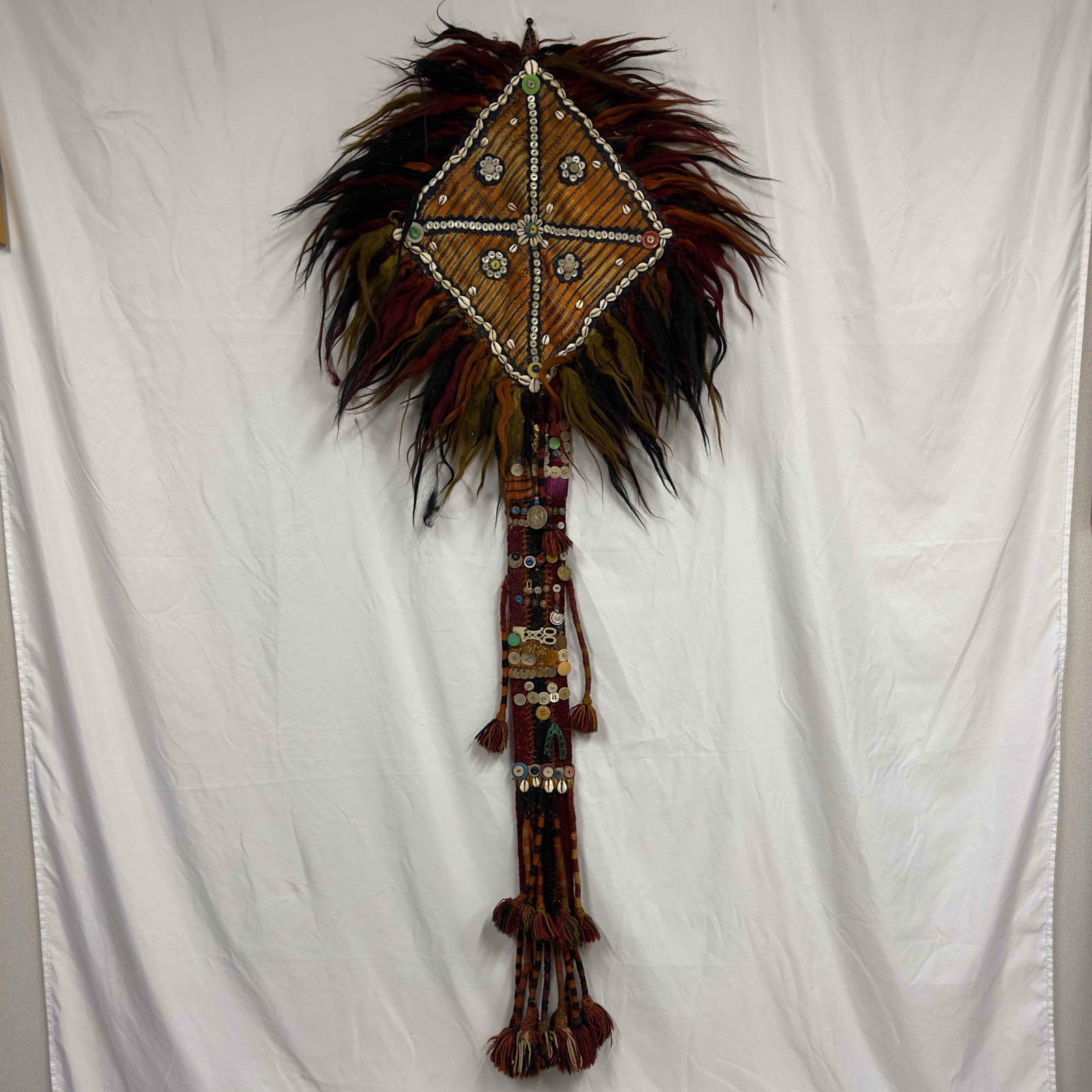 Handmade Tribal Ceremony Fabric Coin Button Shells Wall Artwork Folk Art: Handmade Tribal Ceremony Fabric Coin Button Shells Wall Artwork Folk Art. This folk art fabric tribal ceremony piece has buttons, coins, shells, and other plastic/metal accents. Handmade multicolor fa