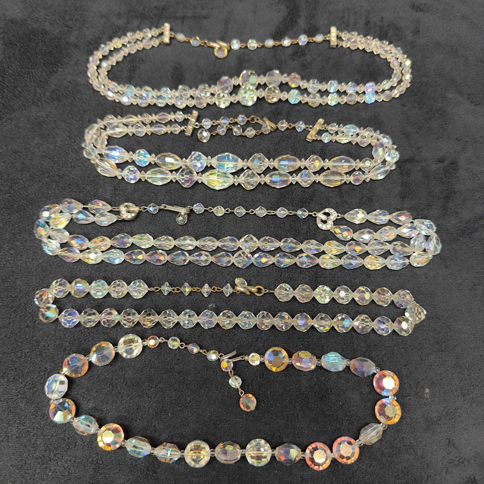 Costume Jewelry Clear Glass Crystal Single and Double Strand Necklace Set Lot of Five H65: Costume Jewelry Clear Glass Crystal Single and Double Strand Necklace Set Lot of Five H65. Necklaces with clear crystal glass beads with beautiful designs. Each necklace features a j hook clasp