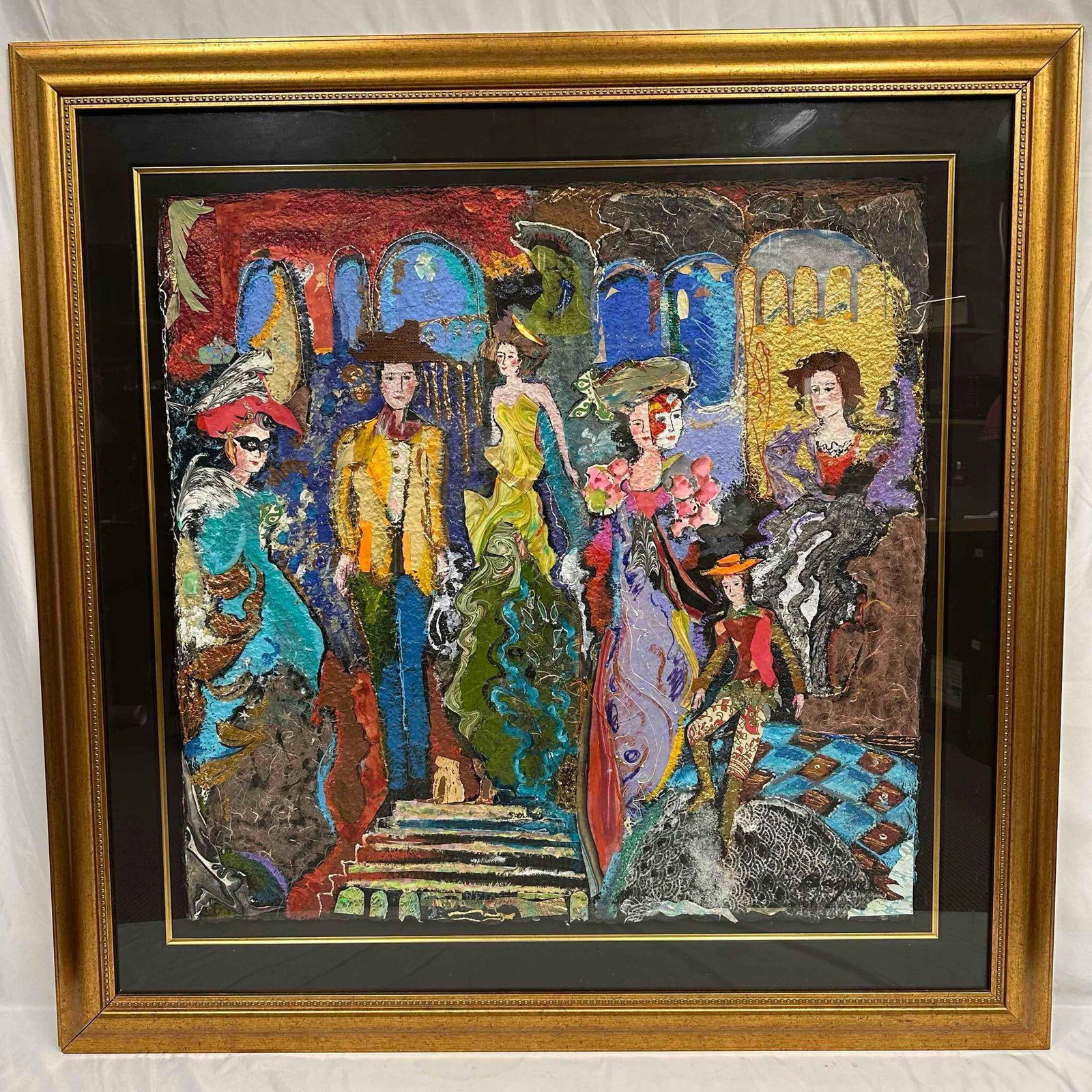 Jane Bazinet Mixed Media Collage Art Painting Colorful Mardi Gras Large Gold Frame: A striking mixed media work of art by Jane Bazinet featuring a lively Mardi Gras masquerade scene of elegantly dressed figures in vibrant, textured layers of color. The composition showcases Bazi