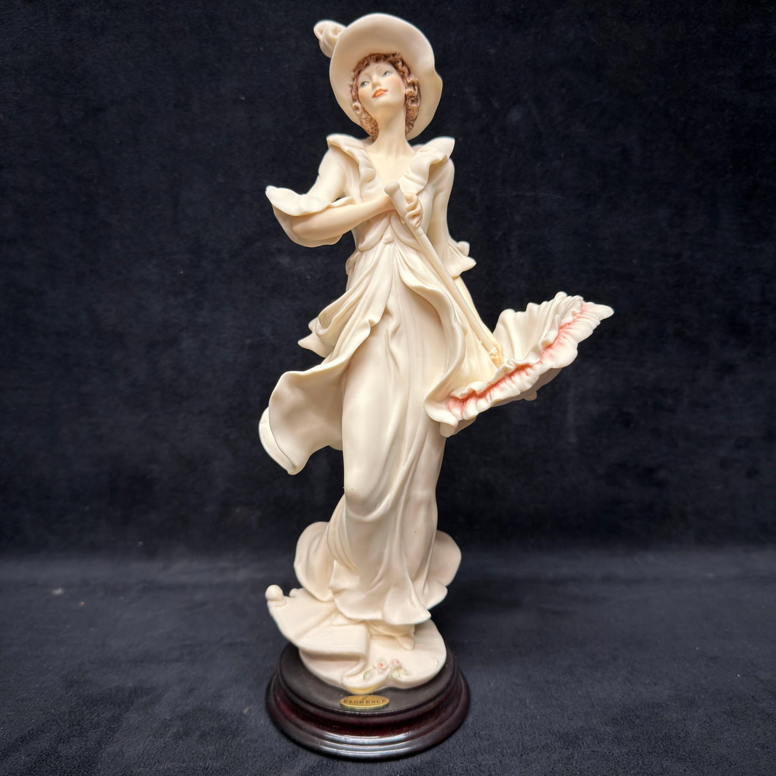 Giuseppe Armani Figurine Sun Shower 0656F Italy R240: Giuseppe Armani Florence Sculture d'Arte porcelain figurine titled Sun Shower, model 0566F, produced in 2001. Depicts an elegant young woman in a flowing dress and wide-brim hat holding an