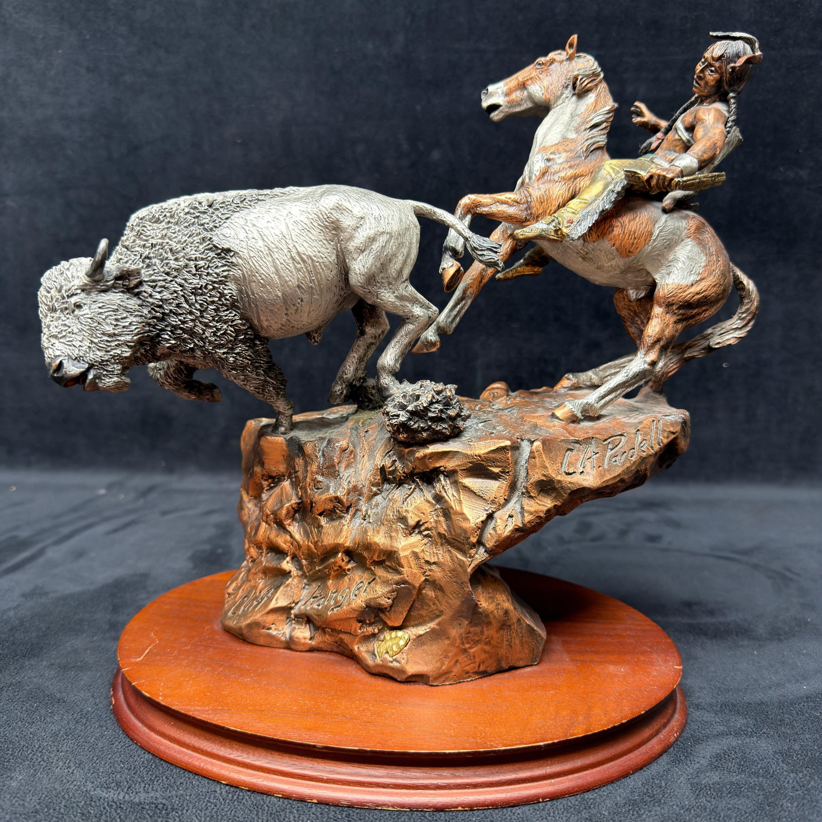 Mixed Media Legends CA Pardell Native American and Buffalo Sculpture Cliff Hanger R240: Limited edition Legends mixed media sculpture by C.A. Pardell, depicting a Native American rider on horseback confronting a charging American buffalo. Finished in hand-painted bronze-tone coloration