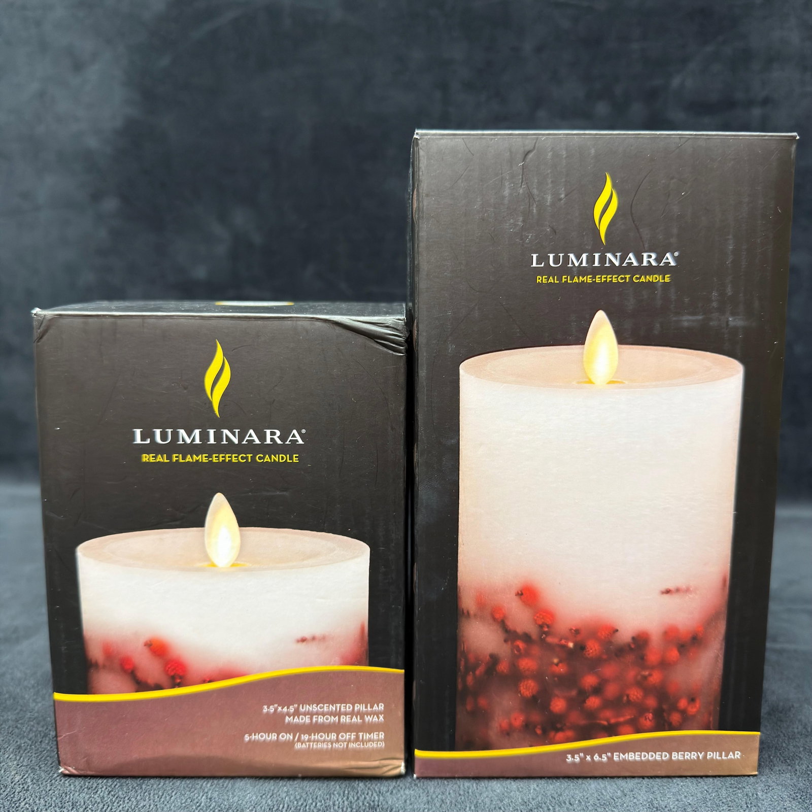 Lot of Two Luminara Real Flame Effect LED Pillar Candles New: Lot of two Luminara Real Flame-Effect LED pillar candles in original boxes. Includes one 3.5" x 4.5" embedded red berry pillar and one 3.5" x 6.5" embedded berry pillar. Made from