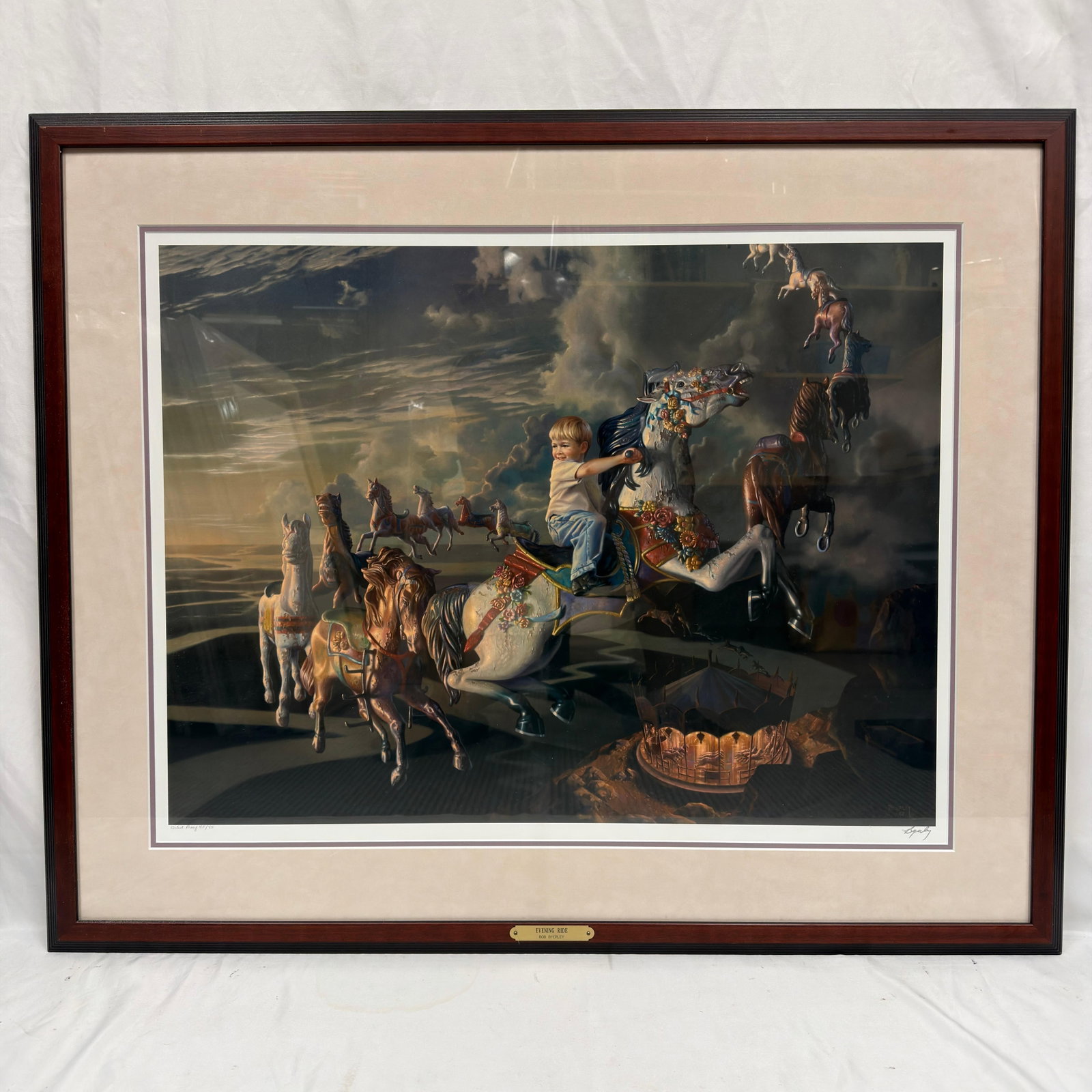 Bob Byerley Evening Ride Hand Signed Artist Proof AP 45 of 75 Framed Giclee Art Print R240: Bob Byerley limited edition giclee print titled Evening Ride. Hand-signed by the artist in pencil and marked Artist Proof 45/75. The artwork depicts a young boy riding a carousel horse beneath a 