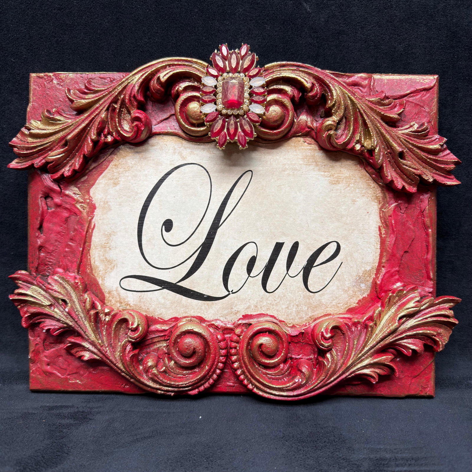 Michelle Butler Designs Love Plaque Red Rhinestone Embellishment: Love red colored decor pieces with scrollwork motifs. Minor chips on resin wood decor. Unique plaque handcrafted art pieces featuring rhinestone accents. Signed by artist Michelle Butler on the back. 