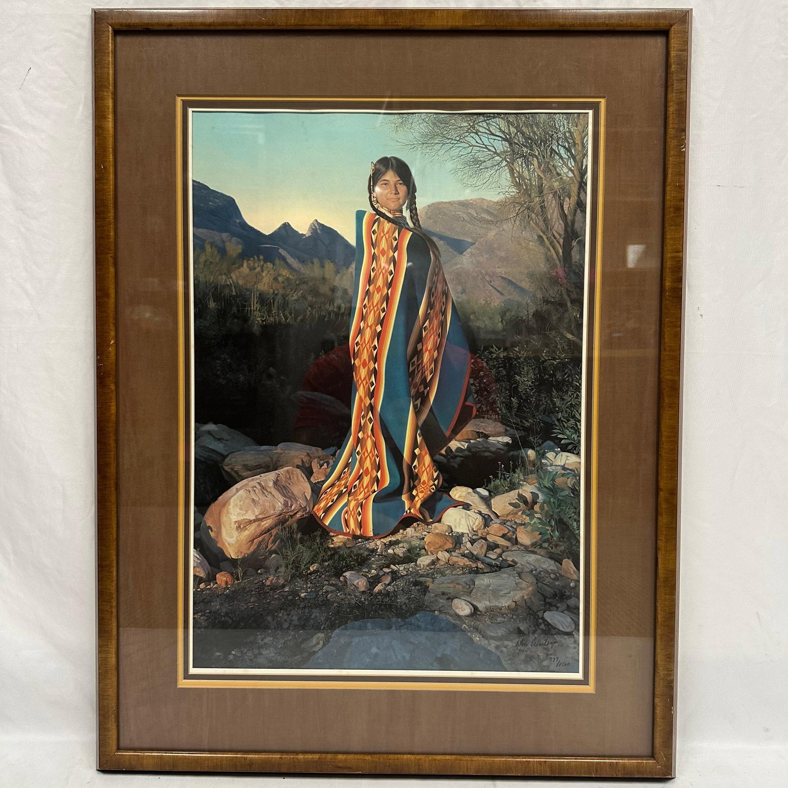 Donald V. Crowley Limited Edition Lithograph Desert Sunset Signed and Numbered Framed: Limited edition lithograph titled Desert Sunset by artist Donald V. Crowley, American, 1926-2022. Beautifully rendered Southwestern portrait depicting a Native woman in a patterned blanket against a d