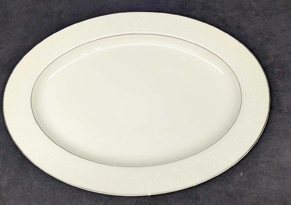 Retired International Juliet 16" Oval Serving Platter: Retired International Juliet 16" Oval Serving Platter. Made of fine china. This is approx 16 1/4" x 12". Comes in a protective cover that is approx 17 3/4" x 12" x 1 1/4". The total weight 