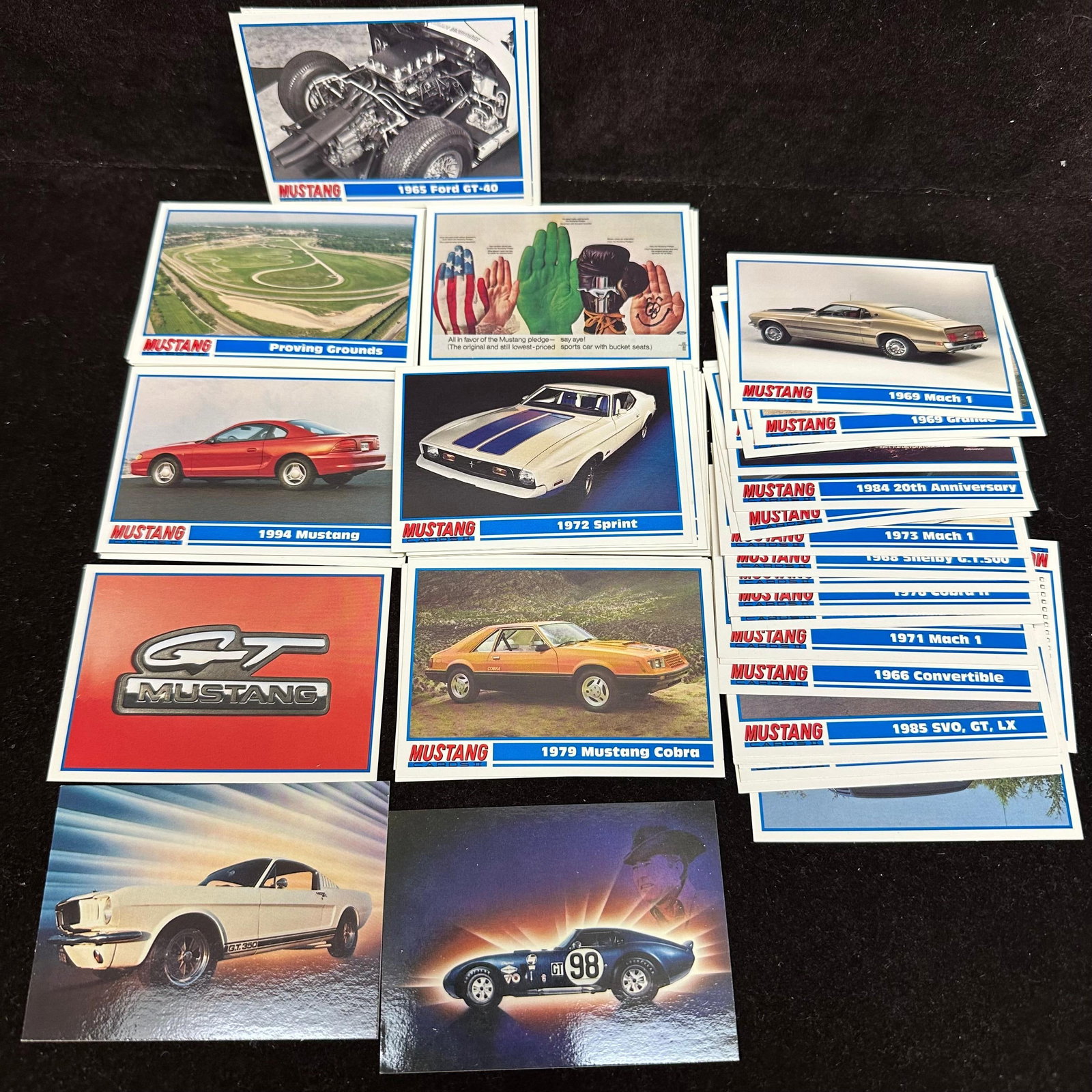 Mustang 1990s Assorted Promo Trading Cards 85 Card Lot: Mustang 1990s Assorted Promo Trading Cards 85 Card Lot. The condition shows typical handling and storage wear consistent with loose trading cards. The lot includes duplicates. Approximately 80 pl