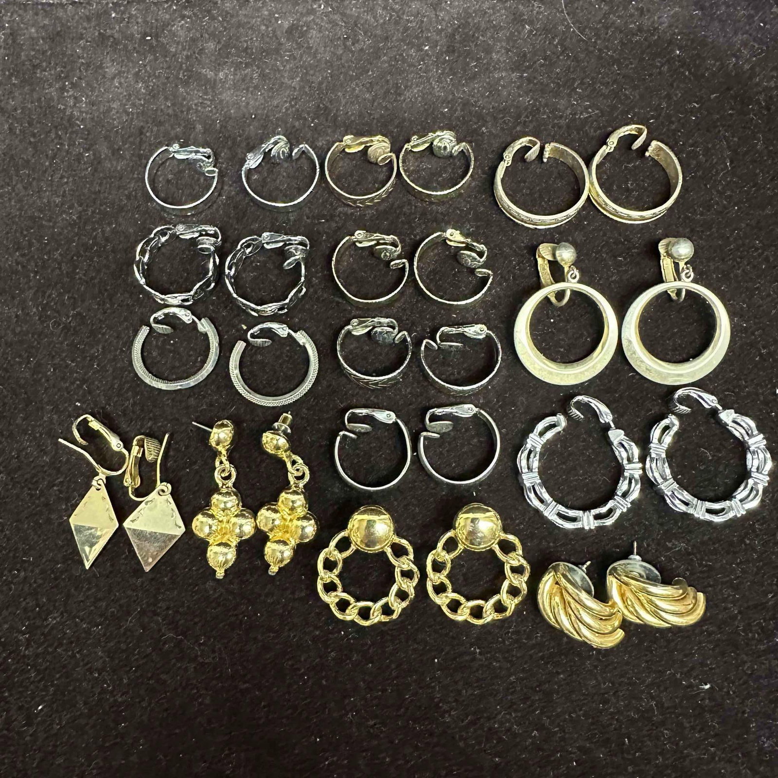 Lot of Vintage Hoop and Statement Earrings Gold and Silver Tone K6: Collection of vintage costume earrings including multiple pairs of silver and gold tone hoops in varying sizes, textured and smooth designs, and clip-on closures. Also includes statement earrings with