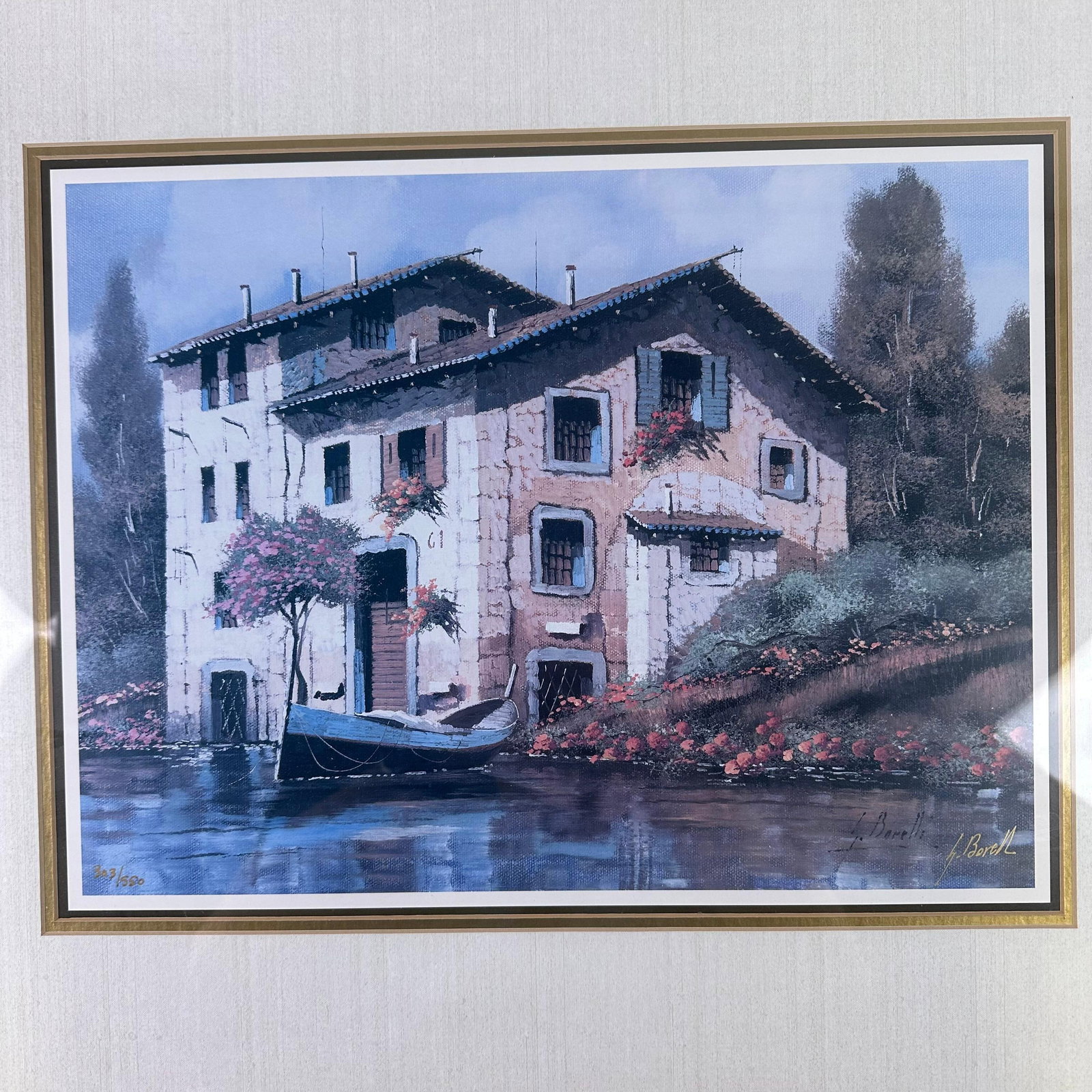 Guido Borelli Venice Framed Lithograph River Reflections Signed And Numbered: Limited edition art print lithograph framed depicting a Venetian canal scene with a gondola in front of a Mediterranean-style waterfront villa. Signed in plate G. Borelli, lower right, and numbered 30