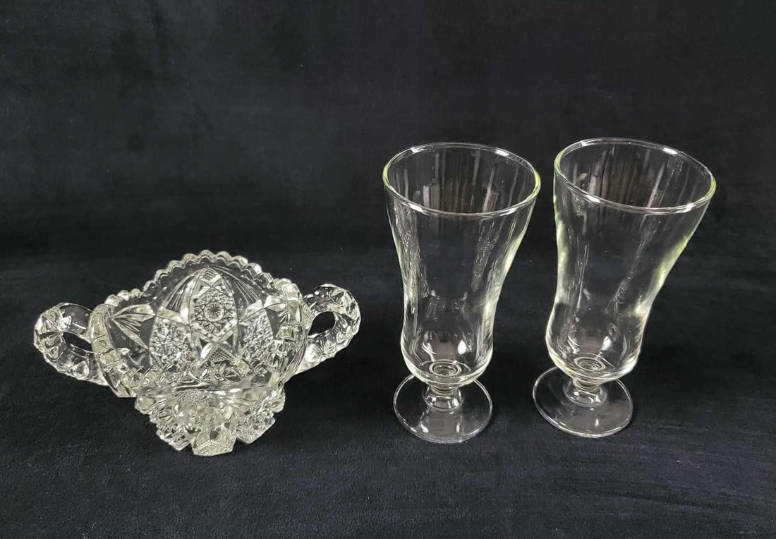 Vintage Glass Nucut Cup And Flute Glasses: This lot includes: (2) Clear glass flute glasses. Simple and clean design.Maker is unknown. Is approx 3" x 3" x 9". Glasses are in very good condition with no known damages. (1) Vinta