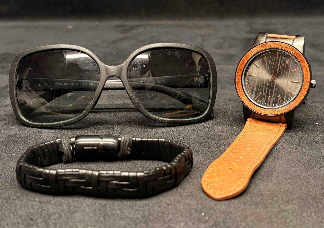 INC International Concepts and BRAND Mens Watches Bundle: This lot contains INC International's Men's watch, model WH 465, a pair of oversized black Foster Grant sunglasses, and a black, braided faux-leather bracelet with a magnetic clasp. The INC