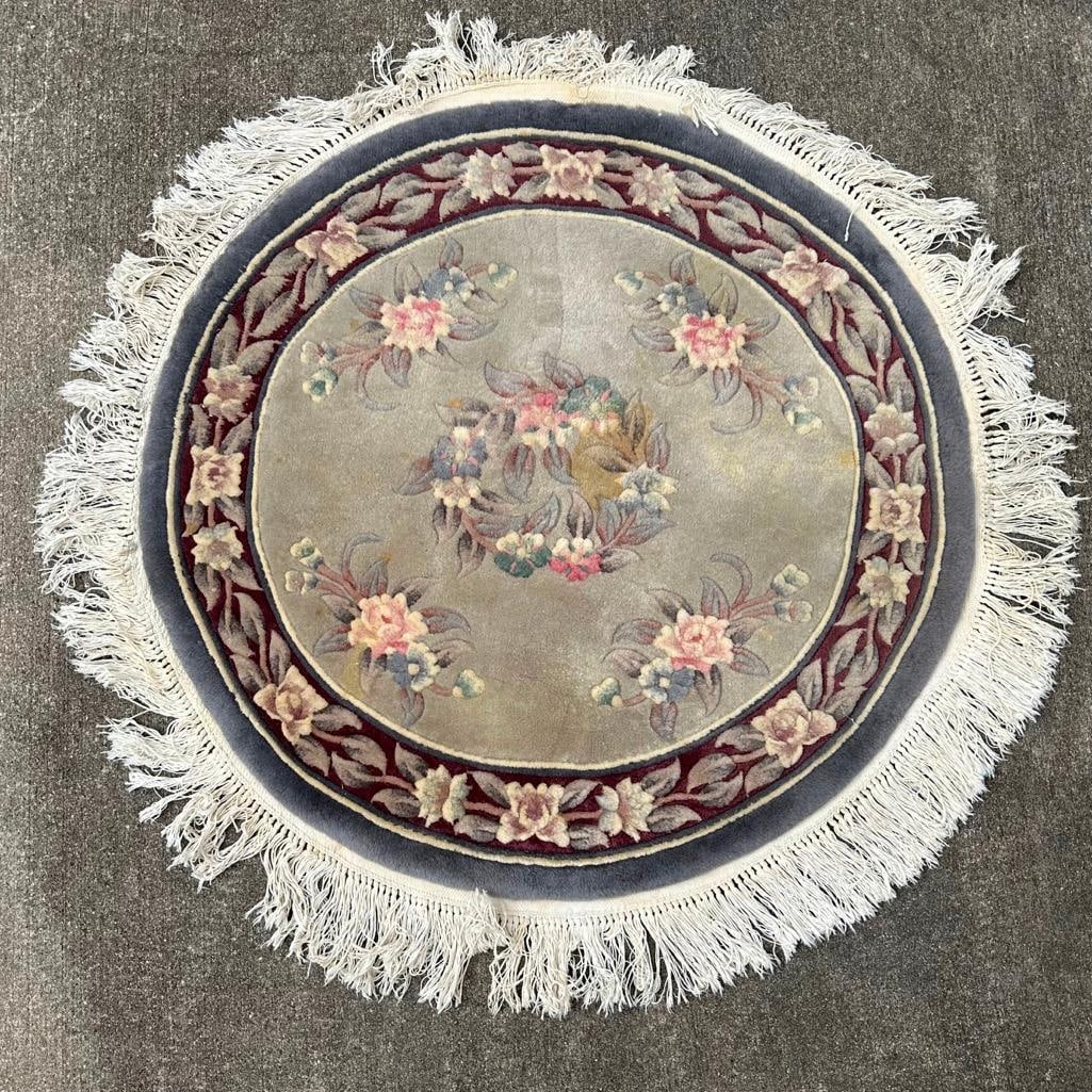 39" Round Oriental Rug in Tan W/ Flowers: 39" Round Oriental Rug in Tan W/ Flowers Vintage round oriental rug with pink flowers in tan. In used condition with some wear and stains. Approximate size: 39" Approximate weight: 8 lbs
