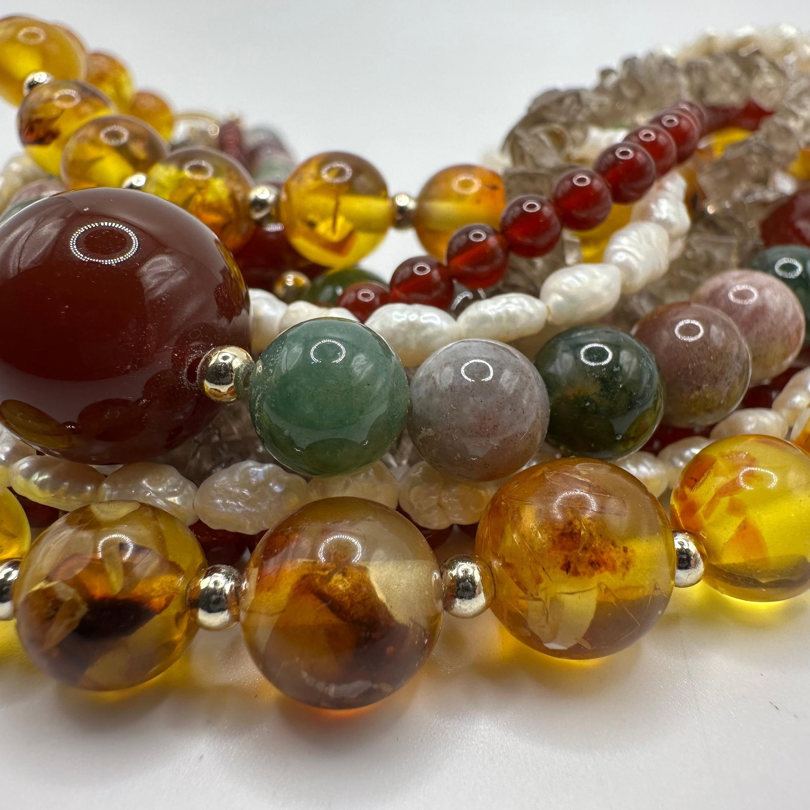 Five Strand Multi Gemstone Carnelian Smoky Quartz Amber Pearl Sterling Silver Clasp Necklace: This item is in good pre-owned, previously used/displayed condition with noticeable light wear and surface scratches. Please reference all photos for full details. This piece of jewelry has been teste