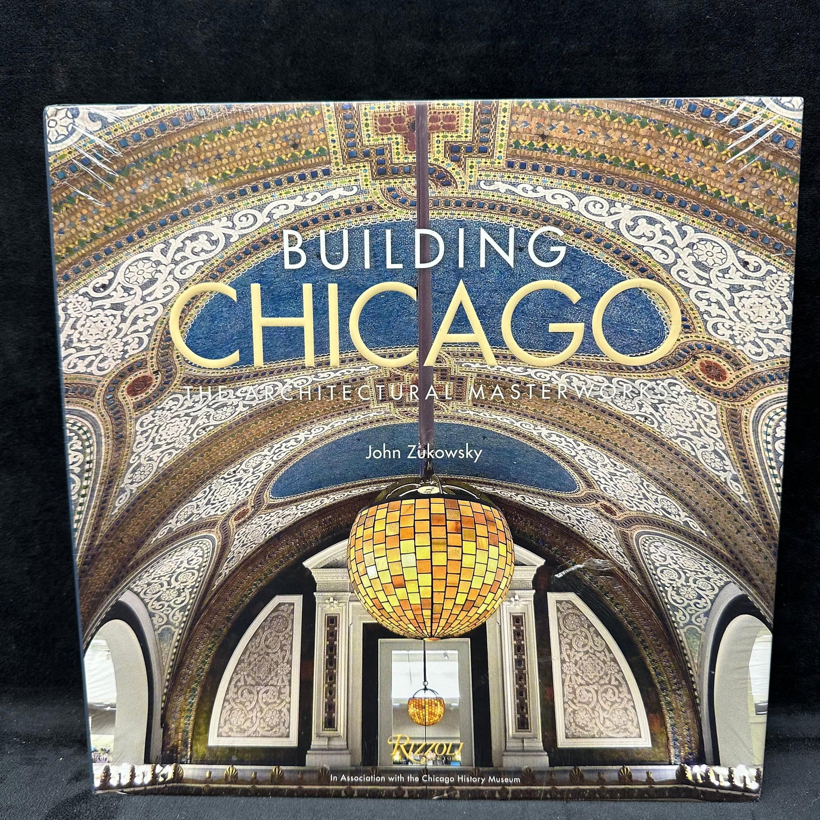 Building Chicago The Architectural Masterworks by John Zukowsky Hardcover Book: Sealed hardcover copy of Building Chicago: The Architectural Masterworks by John Zukowsky, published by Rizzoli in association with the Chicago History Museum. The book remains in its original shrink 