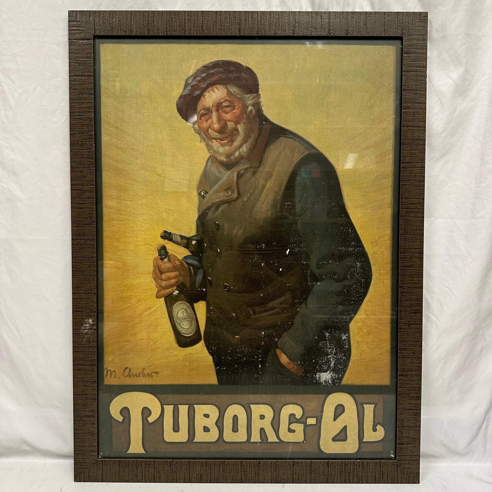 Tuborg Ol Beer Advertising Print Framed: Vintage framed advertising print featuring a cheerful older fisherman holding two bottles of Tuborg beer, after the work of a Danish artist. The image displays warm tones, strong character details, an
