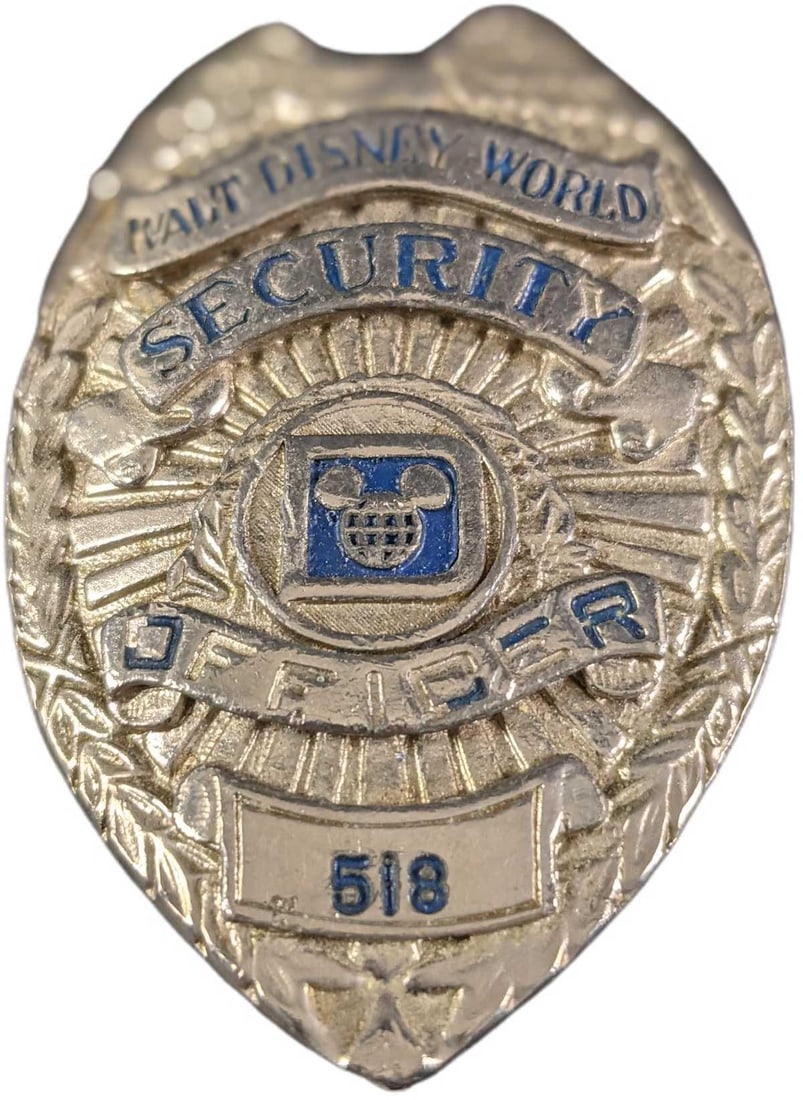 1970s/1980s Disney World Security Metal Badge: 1970s/1980s Disney World Security Metal Badge. Is approx 2 1/4" x 3/4" x 3" and it weighs under one pound at 0.13lb. The metal badge is in a good, vintage condition with some wear, paint loss and mini