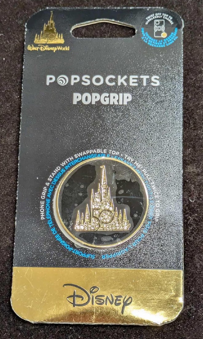 Disney 50th Anniversary Phone Popsockets Popgrip: Disney 50th Anniversary Phone Popsockets Popgrip. New In Box. This is approx 2 3/4" x 1/4" x 5 3/4" and it weighs 0.06lb. The Popgrip has never been removed from its box. Popgrips allows