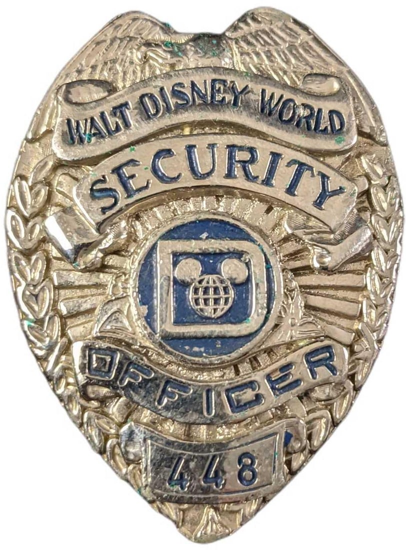 Early 1980s Disney World Female Security Badge: 1970/1980s Disney World Female Security Metal Badge. Is approx 1 1/2" x 3/8" x 2 1/4" and it weighs under one pound at 0.12lb. The metal badge is in a good, vintage condition with some color loss and