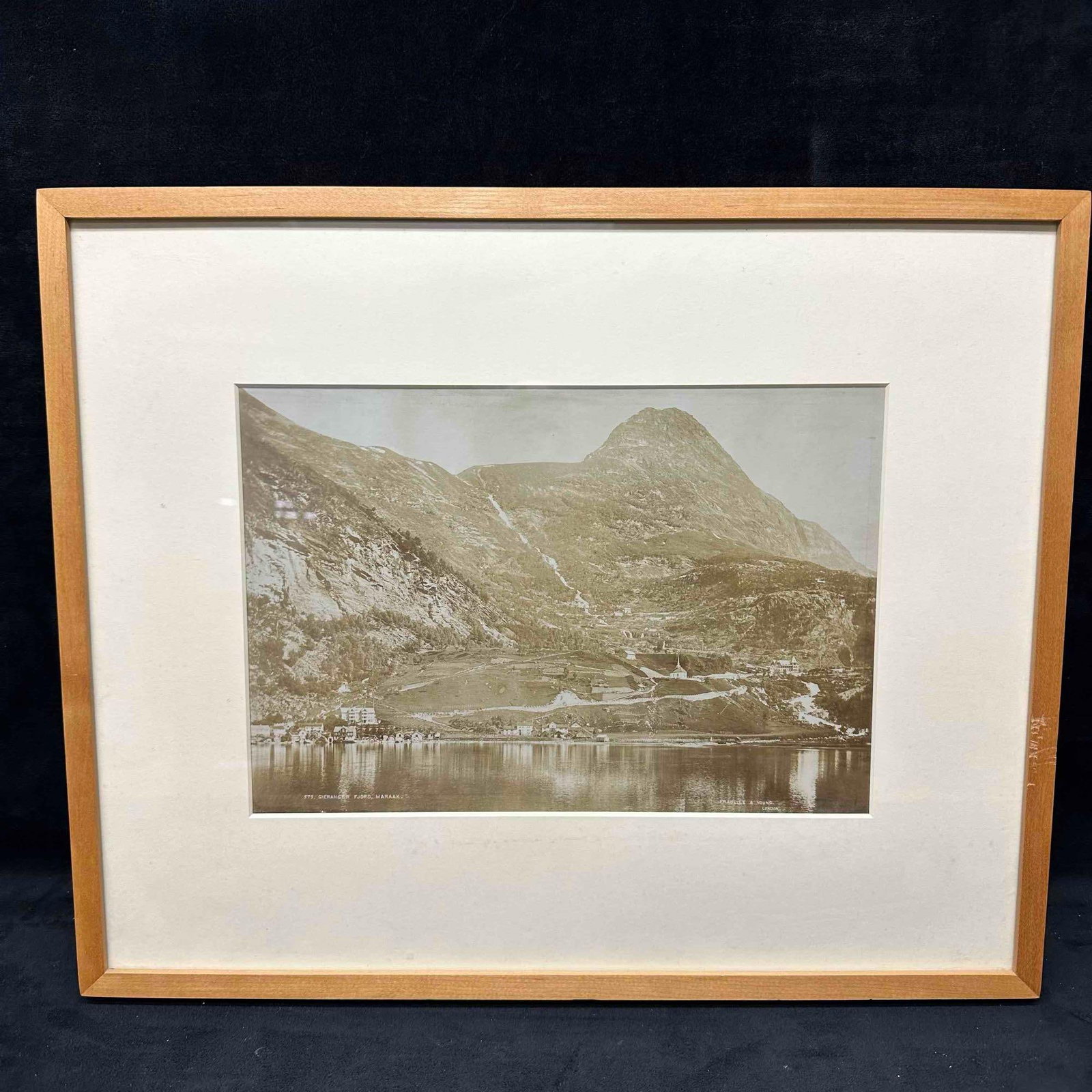 Fradelle and Young Photograph Print Geiranger Norway Fjord Landscape Framed and Matted: Antique sepia-toned photograph of Geiranger, Norway by Fradelle and Young, London. This striking image captures the scenic fjord landscape with mountains and water reflections, a popular 19th–ea