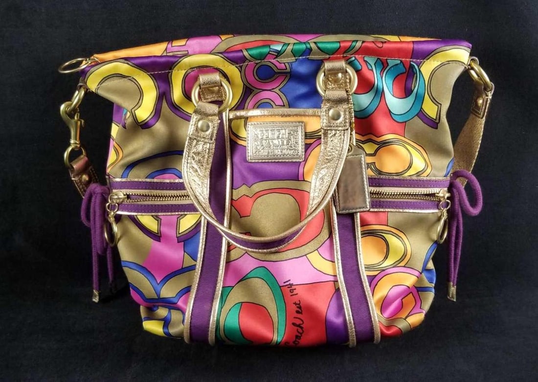 Rare Coach Poppy Purse Bag Tote 14377: Rare Coach Poppy 14377 was a limited creation by Coach. Made in China. The colors are so vibrant, sure to catch your eye. There are multiple pockets inside and out. Comes with arm and shoulder straps 