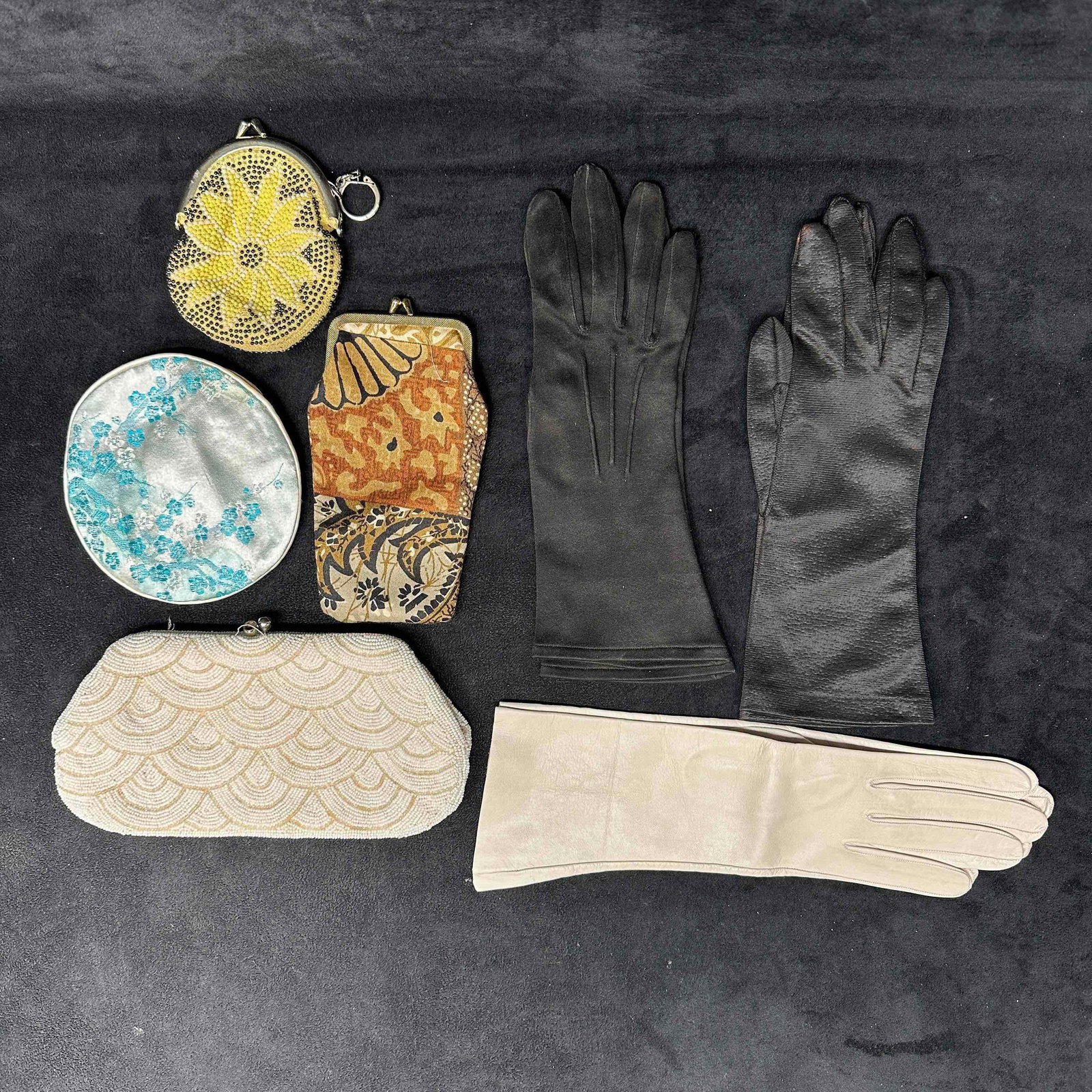 Vintage French Gloves and Clutch Wallet Coin Purse Collection: This set features three pairs of gloves and four wallet, coin purse, and clutch bags. Light black marks and staining on a few pieces of this collection. These items are in good pre-owned, previously u
