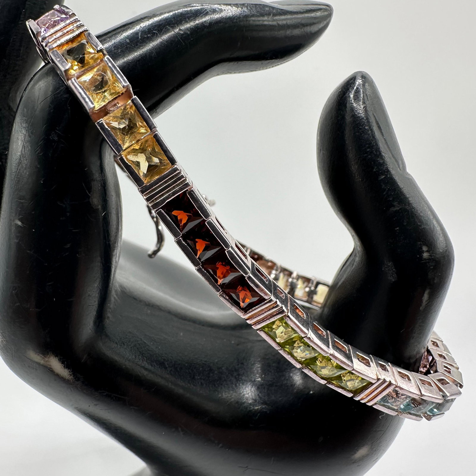 925 Sterling Multi Colored Gemstone Tennis Bracelet Thailand Q17: This item is in good pre-owned, previously used/displayed condition with noticeable light wear and surface scratches. Please reference all photos for full details. This piece of jewelry has been