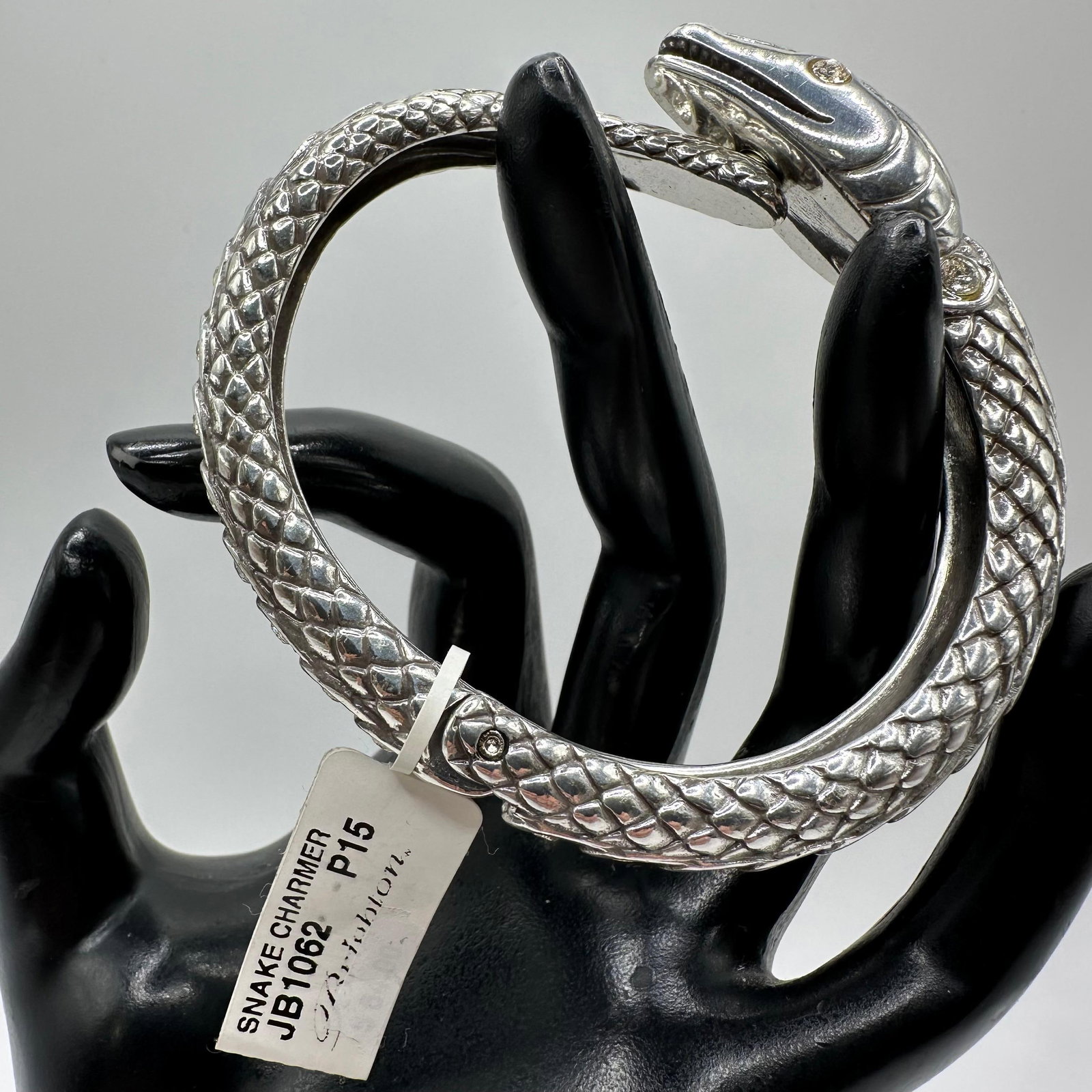 Snake Charmer Brighton Hinged Cuff Bracelet Rhinestone Accent: Original tag still intact. Made in Taiwan. Brighton Snake Serpent Charmer hinged silver-tone bracelet featuring rhinestone accents. This item is in good pre-owned, previously used/displayed condition