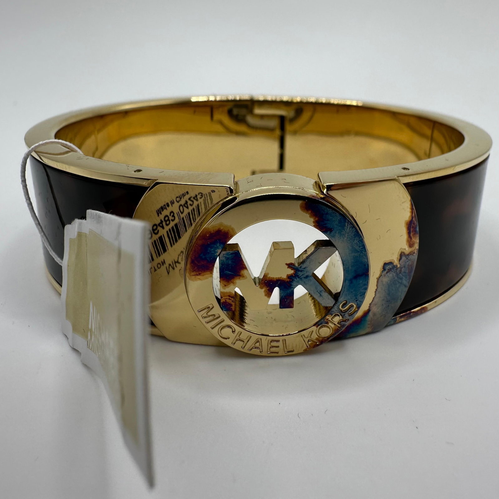 Michael Kors MKJ2928710 Women Bracelet Of Gold and Brown Tortoise Pattern: Original tag still intact. Minor discoloring is noticed on the gold-tone metal. This item is in pre-owned, previously used/displayed condition with light wear and surface scratches. Please reference a