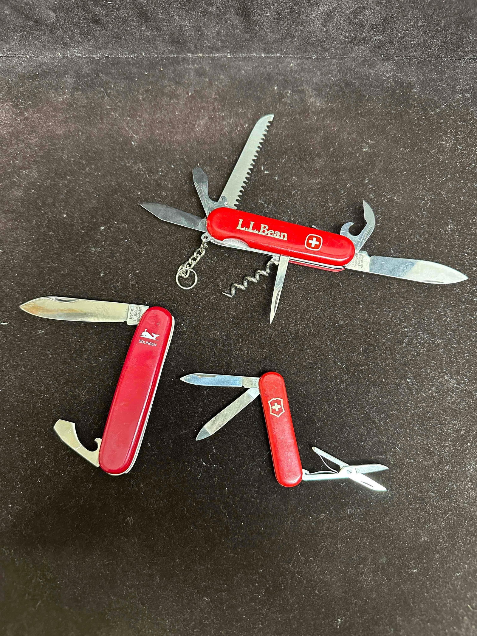 Three Pocket Knives Set Victorinox Switzerland Inox Solingen Germany Wegner Delemont Knife: German and Swiss made pocket knives set. Light rusting or discoloring coloration on metal pieces on the knife, light patina, overall good condition. This item is in good pre-owned, previously used con