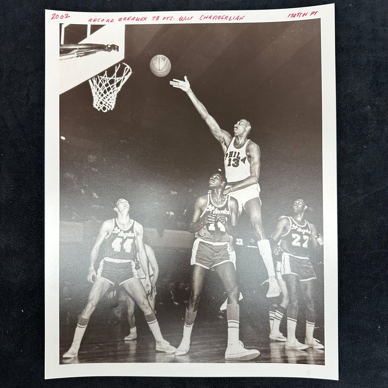 Silver Gelatin Print Wilt Chamberlain Record-Breaking 78 Point Game: An analog photo print capturing basketball legend Wilt Chamberlain of the Philadelphia Warriors during his historic 78-point performance. This iconic black-and-white image shows Chamberlain rising abo