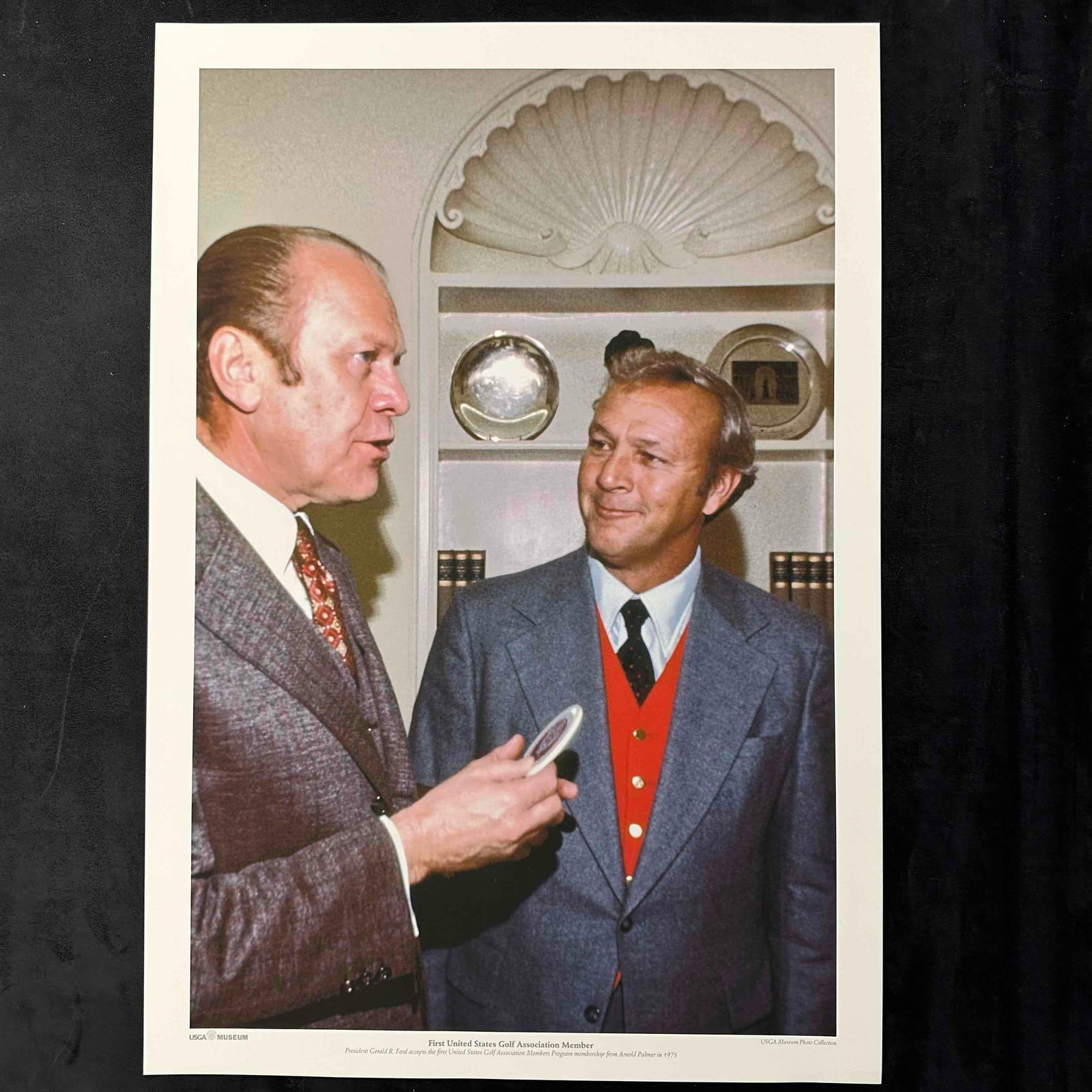 First USGA Member President Gerald Ford and Arnold Palmer Golf Photo Print: Color photo print reproduction from the USGA Museum archives showing President Gerald R. Ford receiving the first United States Golf Association Members Program membership from Arnold Palmer in 1975. 