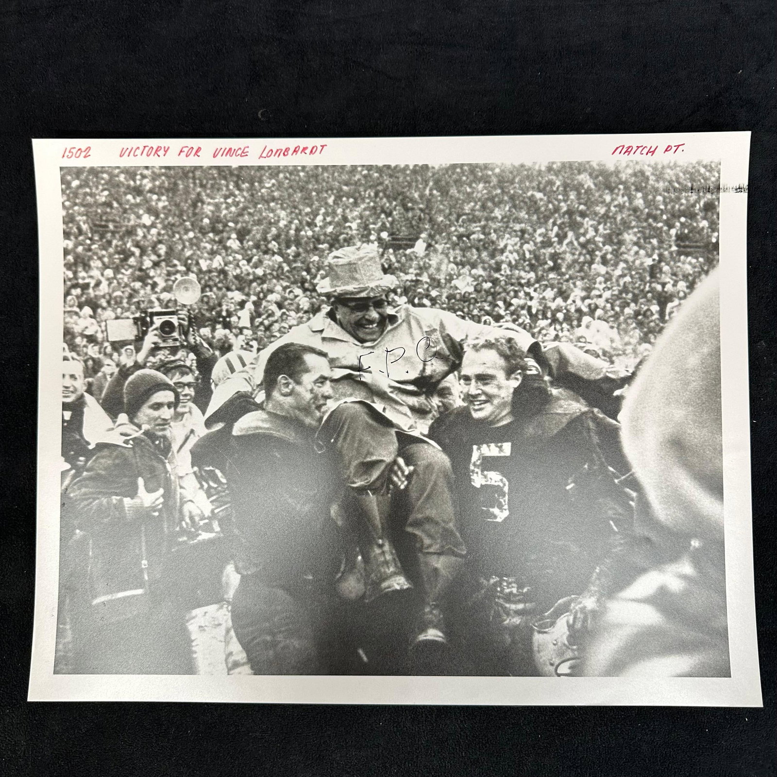 Black and White Silver Gelatin Print Vince Lombardi Victory Celebration: Black and white analog photo print depicting legendary coach Vince Lombardi being carried on the shoulders of jubilant Green Bay Packers players after a victory. The image captures the energy and