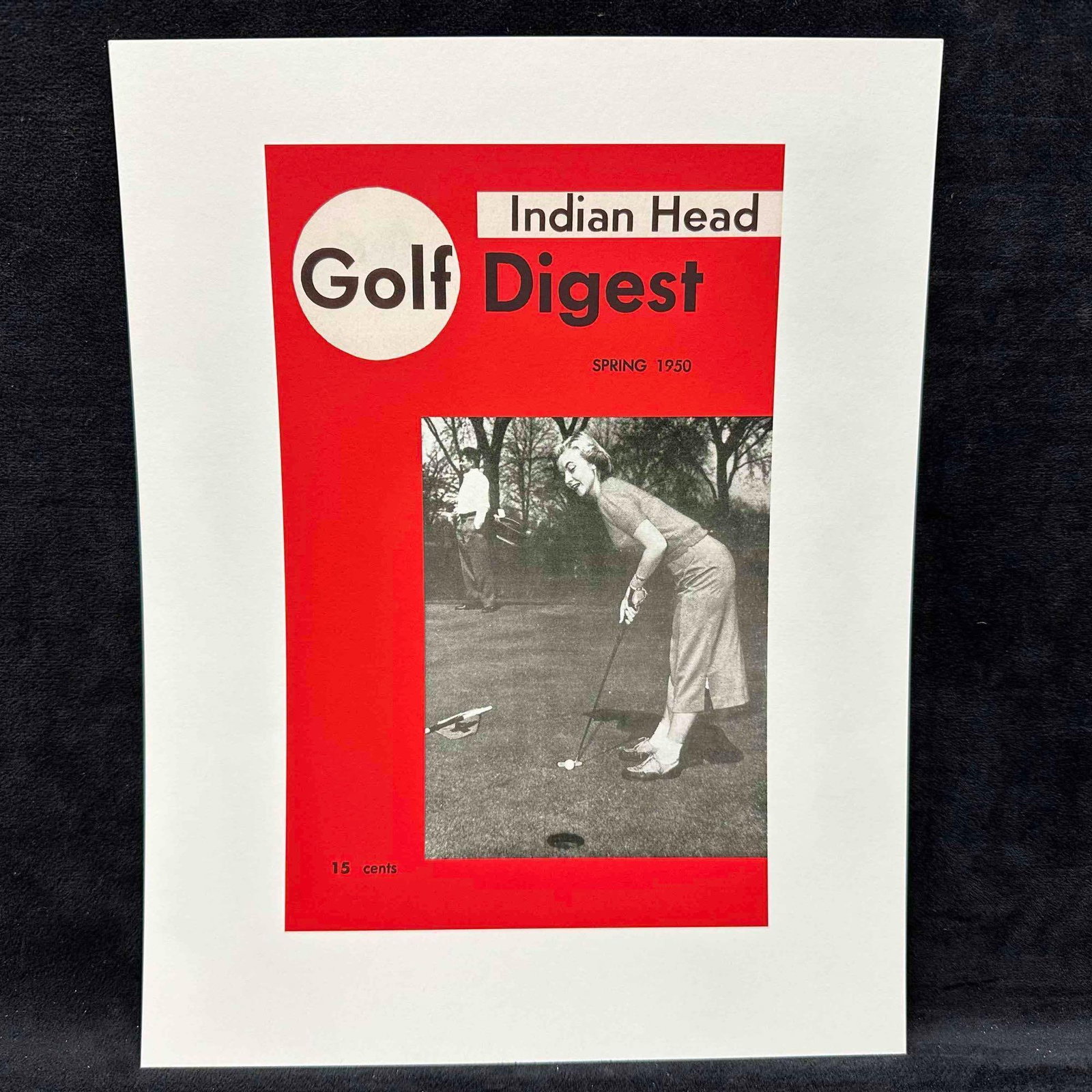Indian Head Golf Digest Spring 1950 Magazine Cover Reprint Lithograph A: Vintage reprint of the Spring 1950 issue of Indian Head Golf Digest, featuring a black-and-white photograph of a woman golfer putting on the green, with a male golfer in the background. Cover printed 
