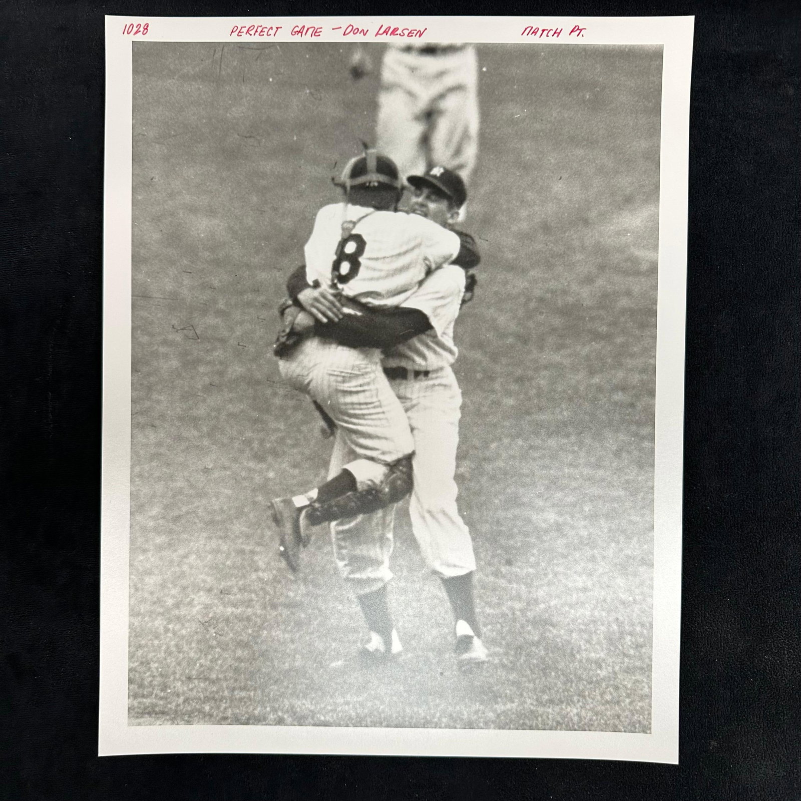 Don Larsen Perfect Game Celebration Yogi Berra Analog Black and White Photo Print: Black-and-white analog photo print capturing Don Larsen’s historic perfect game moment in the 1956 World Series. The image shows catcher Yogi Berra leaping into Larsen’s arms in one of