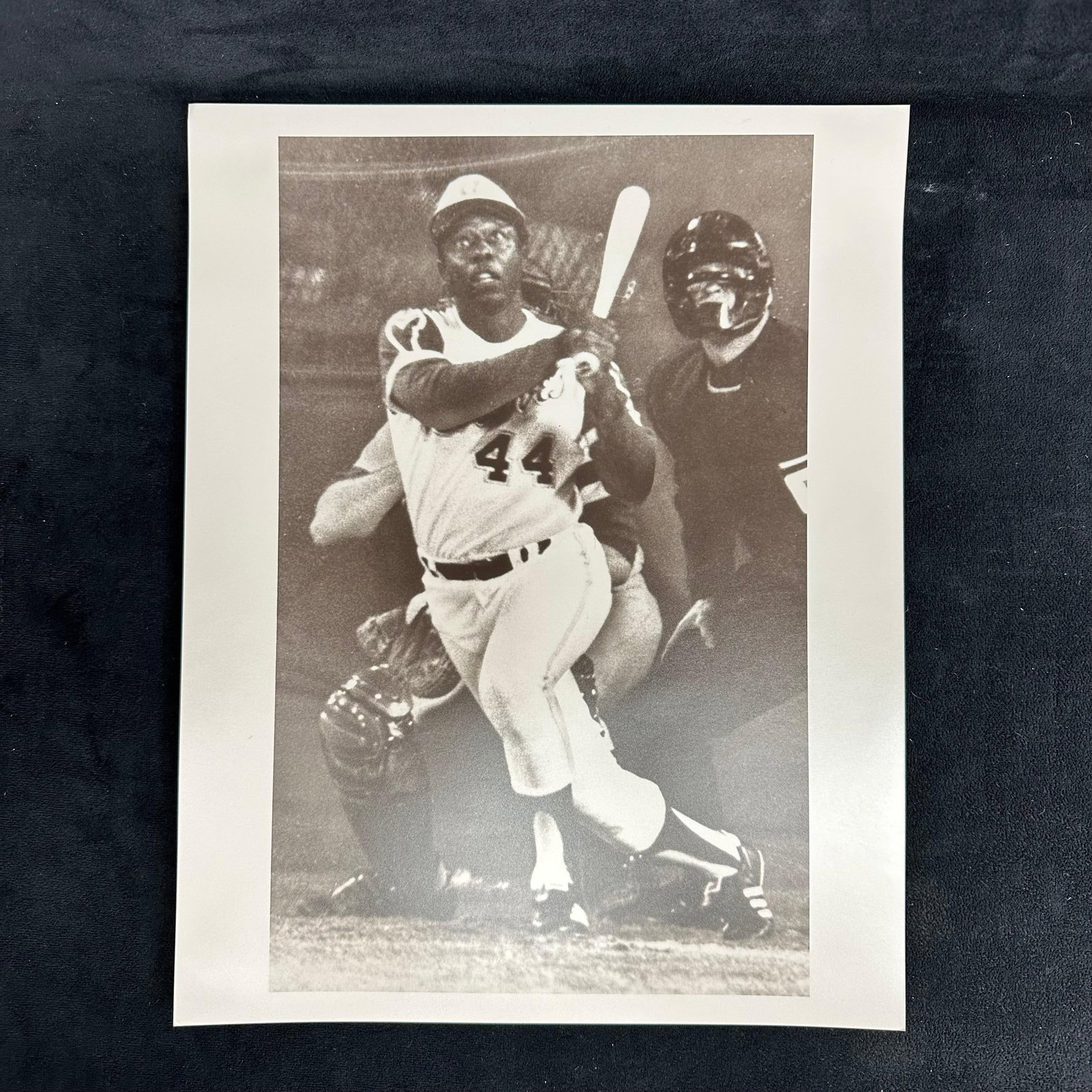 Hank Aaron 715th Home Run Black and White Silver Gelatin Print: Black and white analog photographic print capturing baseball legend Hank Aaron hitting his historic 715th home run, surpassing Babe Ruth’s record. Printed on pearl resin-coated photo paper, the 