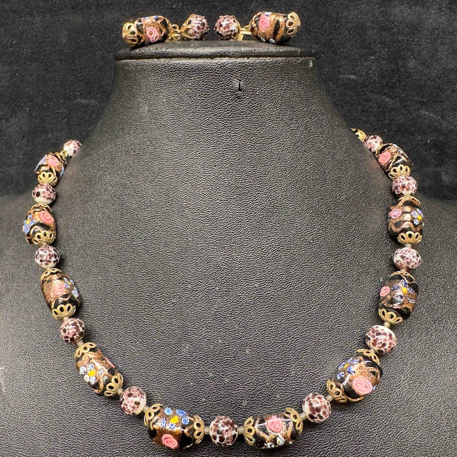 Murano Venetian Art Glass Lamp Work Black White Accents Floral Beaded Necklace and Earrings Set C58: Murano Venetian Art Glass Lamp Work Black White Accents Floral Beaded Necklace and Earrings Set C58. Necklace and earrings with black glass beads with beautiful floral designs on each. The necklace an