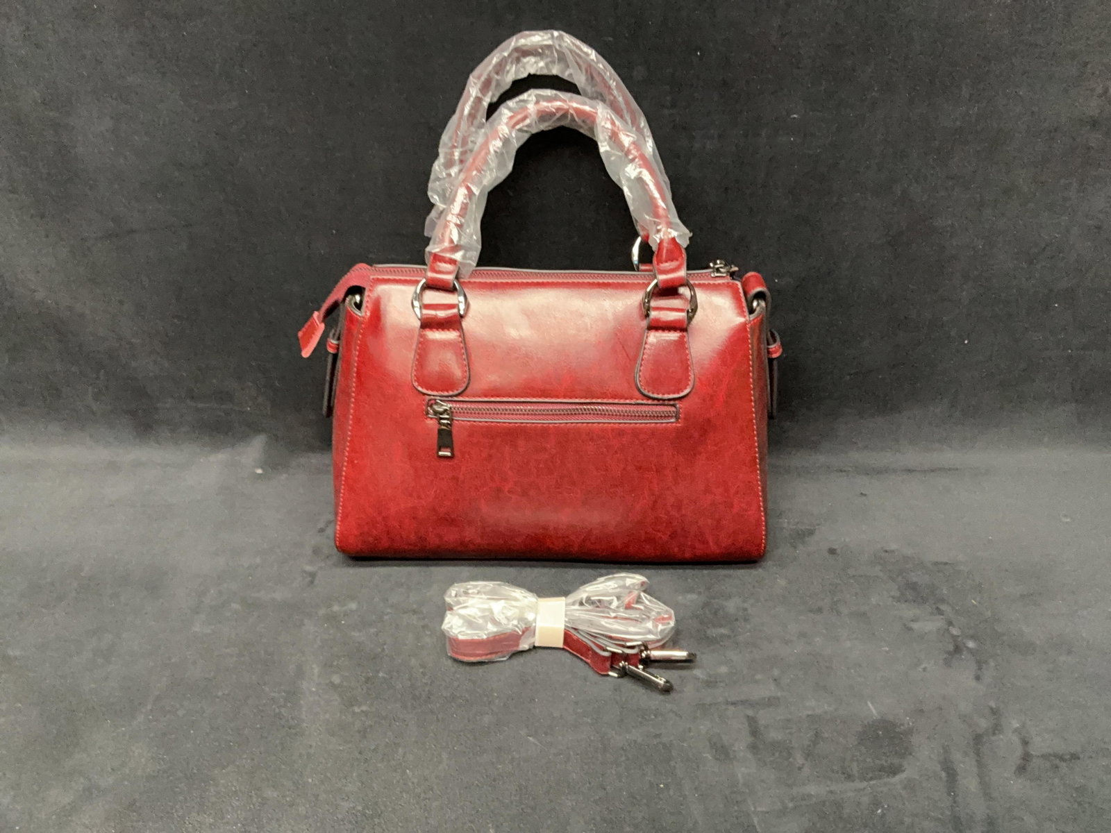 Burgundy Handbag With Shoulder Strap: Burgundy Handbag With Shoulder Strap Approximate Size: 13 x 14 x 6” Approximate Weight: 2 pounds 5.6 ounces