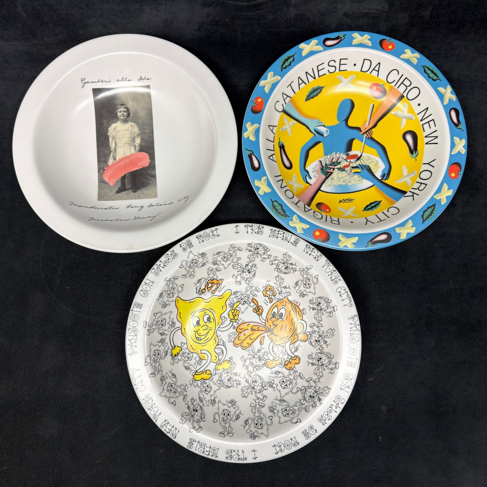 Set of 3 Buon Ricordo America Italian Restaurant Collector Plates: Set of three Buon Ricordo America, Inc. decorative restaurant plates, made in Italy. Includes designs for Manducatis Long Island City by Nicholas Nory, Rigatoni Alla Catanese by Mark Kostabi, and a