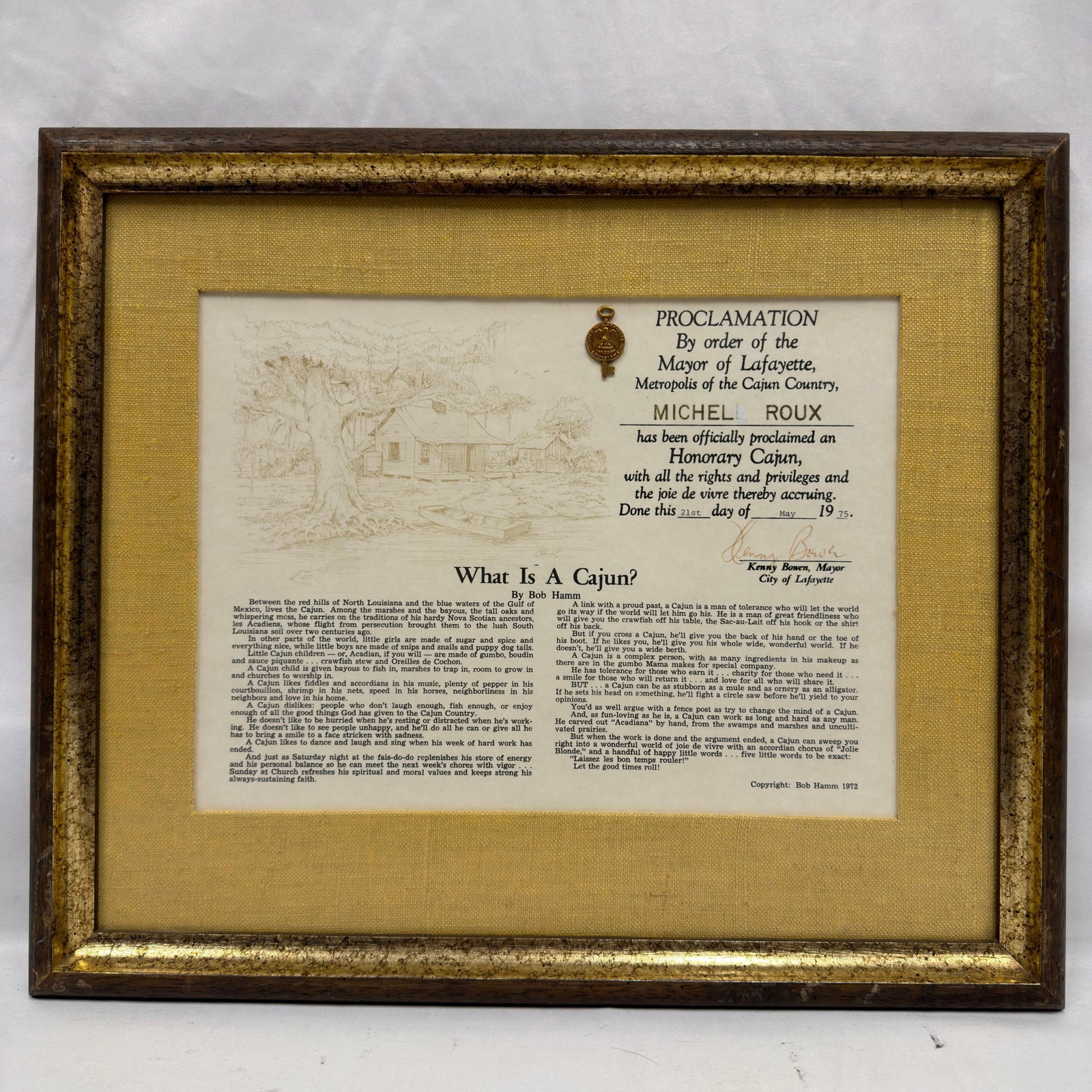 Michel Roux Honorary Cajun Proclamation Lafayette Louisiana Framed Award: Framed proclamation presented to Michel Roux, dated May 21, 1975, officially naming him an “Honorary Cajun” by order of the Mayor of Lafayette, Louisiana. Includes a small applied medallio