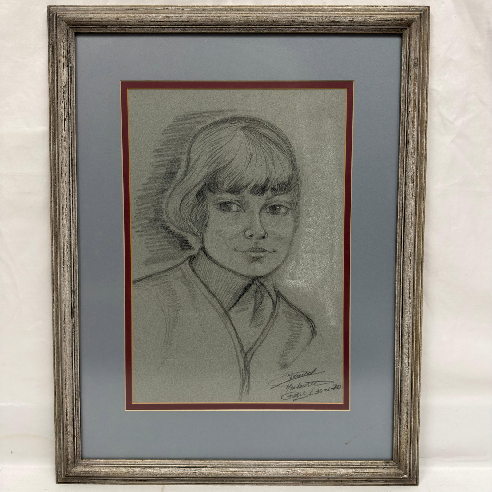 Signed and Dated 1970 Paris Portrait of a Young Woman Drawing Sketch: Vintage charcoal and/or pencil (unknown) portrait drawing depicting a young woman with short hair, executed on gray-toned paper. Signed and inscribed lower right with “Paris”