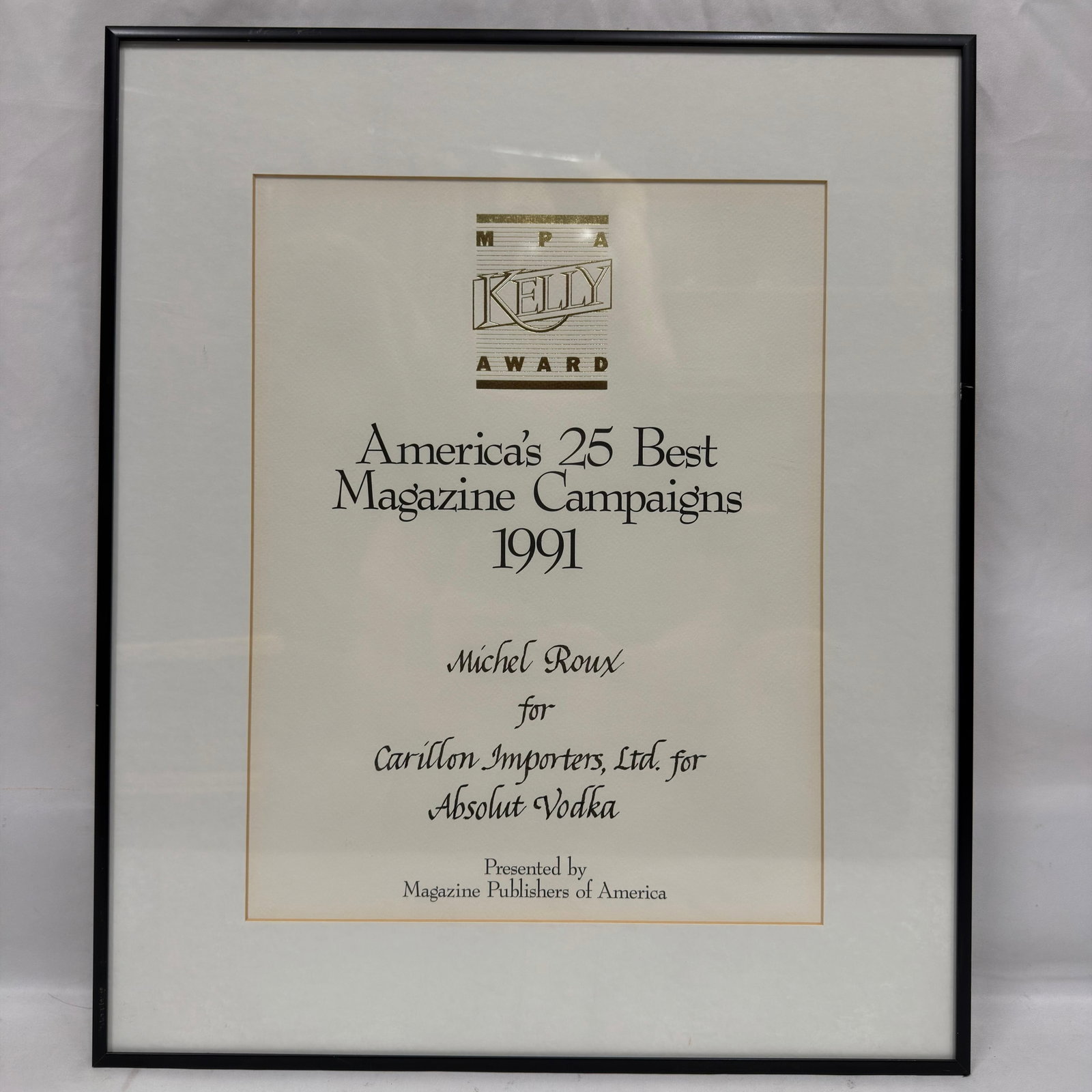 MPA Kelly Award Michel Roux Absolut Vodka Advertising Campaign: Framed 1991 MPA Kelly Award presented to Michel Roux of Carillon Importers, Ltd. for Absolut Vodka. The award recognizes the campaign as one of “America’s 25 Best Magazine Campaigns 1991&#